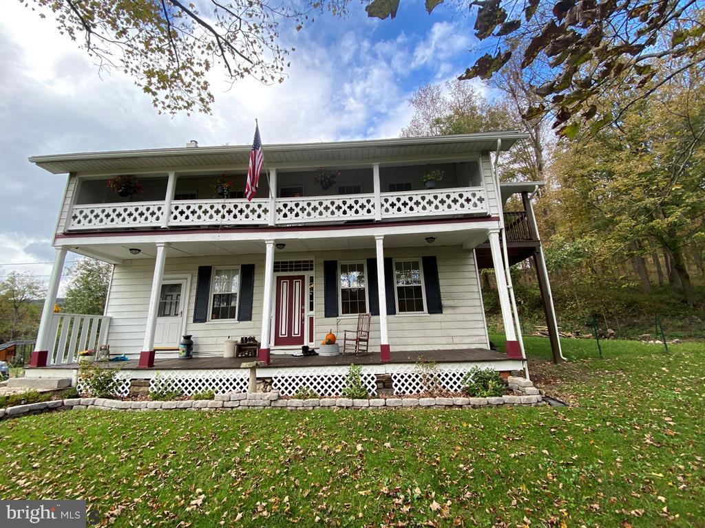 This beautiful Colonial Style home built in the 1800's is filled with original charm, but updated with today's amenities. This home is spacious with four large bedrooms, an eat-in kitchen and one full bathroom. You'll love the high ceilings, original and refurbished wide plank flooring, three decorative fireplaces and two covered balconies. Electrical, windows and furnace are all newer and the third floor is ready to be finished, including plumbing for an additional full bathroom. The private back yard is a great space to entertain with a patio and fenced area.