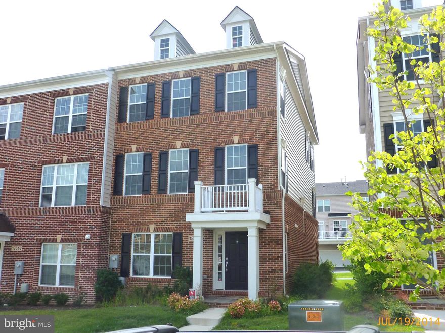 Contract fell through. Gorgeous  2 year young Brick-Front END UNIT townhouse with large 2 car garage. Gourmet kitchen with granite counter top, large island, stainless steel appliances.  Hardwood flooring in kitchen and breakfast room.  Rec room with fireplace.  Community with rec center and swimming pool.