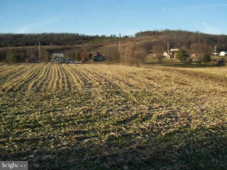 Motivated Seller! 7.8 acres of level commercial land or other wise. Currently used for agricultural purposes. Public sewage available. Close to by pass and town.