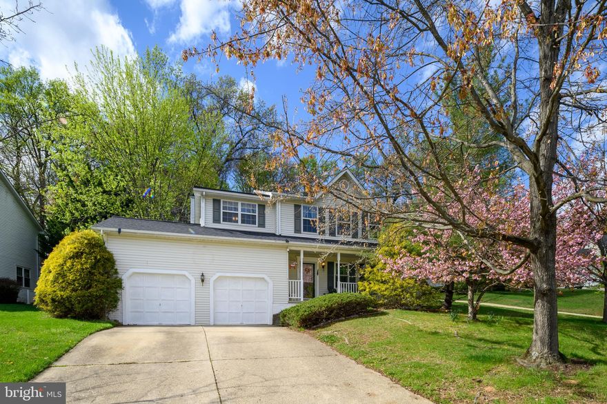 HOWARD COUNTY TREASURE FOR ALL SEASONS-FROM THE FULL FRONT PORCH & DECK FOR ENJOYING THE SUMMER SUN TO THE COZY FIREPLACE FOR WINTER COMFORT! THIS LOVELY 4BD/2/1 BATH TRADITIONAL COLONIAL HOME ON A PEACEFUL CUL-DE-SAC HAS RECENTLY BEEN UPDATED-NEW ROOF (2025), HVAC (2024), HOT WATER HEATER (2021) AND UPGRADED MAIN LEVEL WINDOWS (2025)! CARPET HAS BEEN REPLACED ON THE MAIN & UPPER LEVELS WITH LAMINATE FLOORING. KITCHEN HAS UPDATED GRANITE COUNTERTOPS, GRANITE TOPPED ISLAND, RAISED PANEL OAK CABINETS, WHITE SUBWAY TILE BACKSPLASH & FRENCH DOOR CLEAN STEEL GE REFRIGERATOR WITH ICE/WATER DISPENSER, EZ CLEAN GLASS TOP STOVE & BUILT-IN MICROWAVE & PANTRY. KITCHEN ADJOINS FAMILY ROOM/"KEEPING" ROOM WITH WOOD-BURNING FIREPLACE WITH HEATILATOR AND BREAKFAST ROOM/DINING AREA. SUNLIT BREAKFAST ROOM SLIDER OPENS TO SPACIOUS DECK & PATIO. MAIN LEVEL HAS A POWDER ROOM, EXTENSIVE LIVING ROOM AND DINING ROOM THAT EXTENDS FROM THE FRONT OF THE HOME TO THE BACK WITH NUMEROUS WINDOWS FOR RADIANT SPACES. UPPER LEVEL HAS FOUR SPACIOUS BEDROOMS, ALL WITH CEILING FANS. PRIMARY SUITE HAS A WALL OF CLOSETS & WALK-IN CLOSET, ADJOINING SUPER BATH WITH DOUBLE VANITY, SKYLIGHT, JETTED TUB AND WALK-IN SHOWER. OVERSIZED SECOND BEDROOM HAS 2 CLOSETS. LOWER LEVEL IS PARTIALLY FINISHED WITH MULTIPLE CLOSETS, SEPARATE LAUNDRY ROOM (WASHER & DRYER CONVEY) WITH LAUNDRY TUB. BACKYARD HAS A PRIVATE VIEW BACKING TO TREES. CONVENIENT LOCATION NEAR ROUTE 1, 100 AND 695. NO HOA. MOVE IN READY. -- CALL TODAY FOR A PRIVATE TOUR!