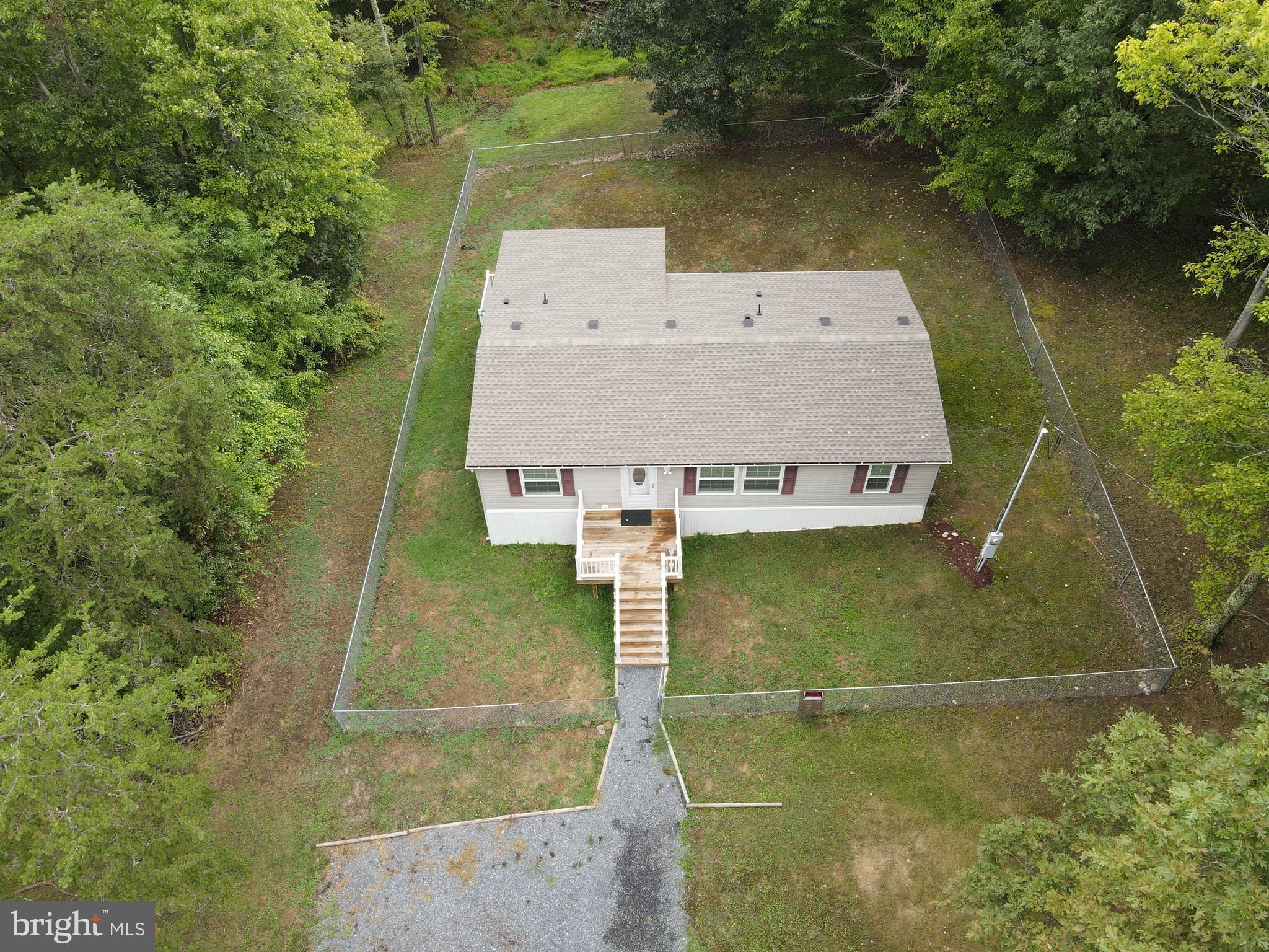 Call today to see this spacious manufactured home with an open floor layout, 3 bedrooms and 2 full bathrooms sitting on a 2 acre lot. This home was completely remodeled recently and offers one floor living. Updated roof, HVAC, water filtration system, flooring. New 12,000 watt portable generator with 3 back up electric heaters in case power goes out in the winter months. The house has a fenced yard for your children or pet animals. Relax or grill out on the rear covered deck. This property is a short distance to the community access to the South Branch of the Potomac River where you can boat, kayak, fish or swim. The list of upgrades and improvements are impressive and extensive. Call today to learn more!