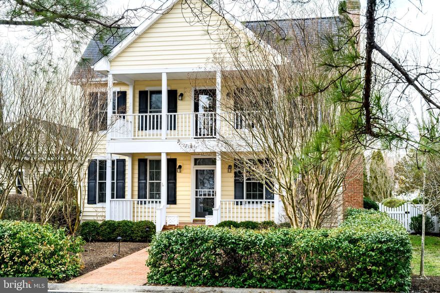 Discover this exceptional new listing in one of Talbot County’s most desirable neighborhoods of Cooke’s Hope. Ideally situated just off Oxford Road in Easton, the community offers numerous amenities and unmatched convenience, located only five minutes from both downtown Easton and Talbot Country Club.
Set on quiet Wheeler Park Circle, one of the community’s most sought-after village locations, this home offers just under 3,000 square feet of finished living space. Broad double covered front porches create a welcoming front exterior, while at the rear of the home a large, private screened porch off the kitchen opens to a fully fenced backyard with patio—ideal for outdoor living and entertaining. The main level features a first-floor primary suite with a lovely, updated bath and huge walk-in closet. Hardwood floors enhance the rest of the first floor including the beautiful light-filled living room with gas fireplace, a formal dining room, convenient powder room and a spacious den with built ins that flows into a beautifully updated eat in kitchen with mostly new appliances. A large separate first floor laundry/mud room provides not only washer and dryer but abundant cabinetry and a utility sink for added convenience.
Upstairs, a wide hardwood hallway leads to three additional bedrooms, a full bath, and spacious fully insulated storage room complete with a mini split system, space easily finished if desired.  An oversized attached two car garage, accessed by a private concrete drive from the rear alley, completes this well-designed home.   Owner has meticulously maintained this property since purchase in 2018 including new roof, kitchen appliances, water heater, interior paint, etc.  The Cooke’s Hope HOA maintains a reserve fund, manages community operations and common areas, oversees the community waterfront park and dock, and supports additional amenities including a gym, mail room, tennis/pickleball court, dog park, over three miles of walking paths, ponds, picnic areas, roads, trash service, and snow removal.  The HOA has a set yearly fee for these services and provides front and side yard maintenance at a reasonable additional cost to the property owners.  The community is served by Easton Utilities, providing electric, water, sewer, natural gas, and fiber optic high-speed internet.  Extra refrigerator and two custom carpets for living and dining rooms (all in garage) included.