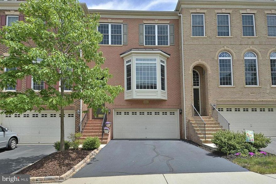 Welcome home to this meticulously maintained townhome in the highly sought-after Braddock Corner! With a New Roof, this townhome offers over 2,600 sq. ft. of living space across three levels, including 3 bedrooms, 3 full baths, and 1 half bath, along with an attached TWO-car garage.

The main level boasts a spacious and updated kitchen, a sun-filled dining room, and a living room adorned with french doors that lead out to a generously-sized, Maintenance- Free Deck. Moving to the upper level, you'll find a primary bedroom with a vaulted ceiling, a HUGE walk-in closet, and an en-suite primary bath complete with a soaking tub, walk-in shower, and double vanities. Additionally, there are two more ample bedrooms and another full bath on this level, as well as convenient upper-level laundry.

The Fully Finished Walk-Out Basement provides even more space for entertainment, featuring a full bath and plenty of windows that flood the area with natural light. This home offers a superbly convenient location, being in close proximity to Paul VI High School, the Loudoun County Recreation Center, Virginia wine country, Dulles Airport, and major commuter routes.

 Best of all, NO rentback  is needed and you can move in right away! HOA takes care of lawn maintenance and this home is ready for you!