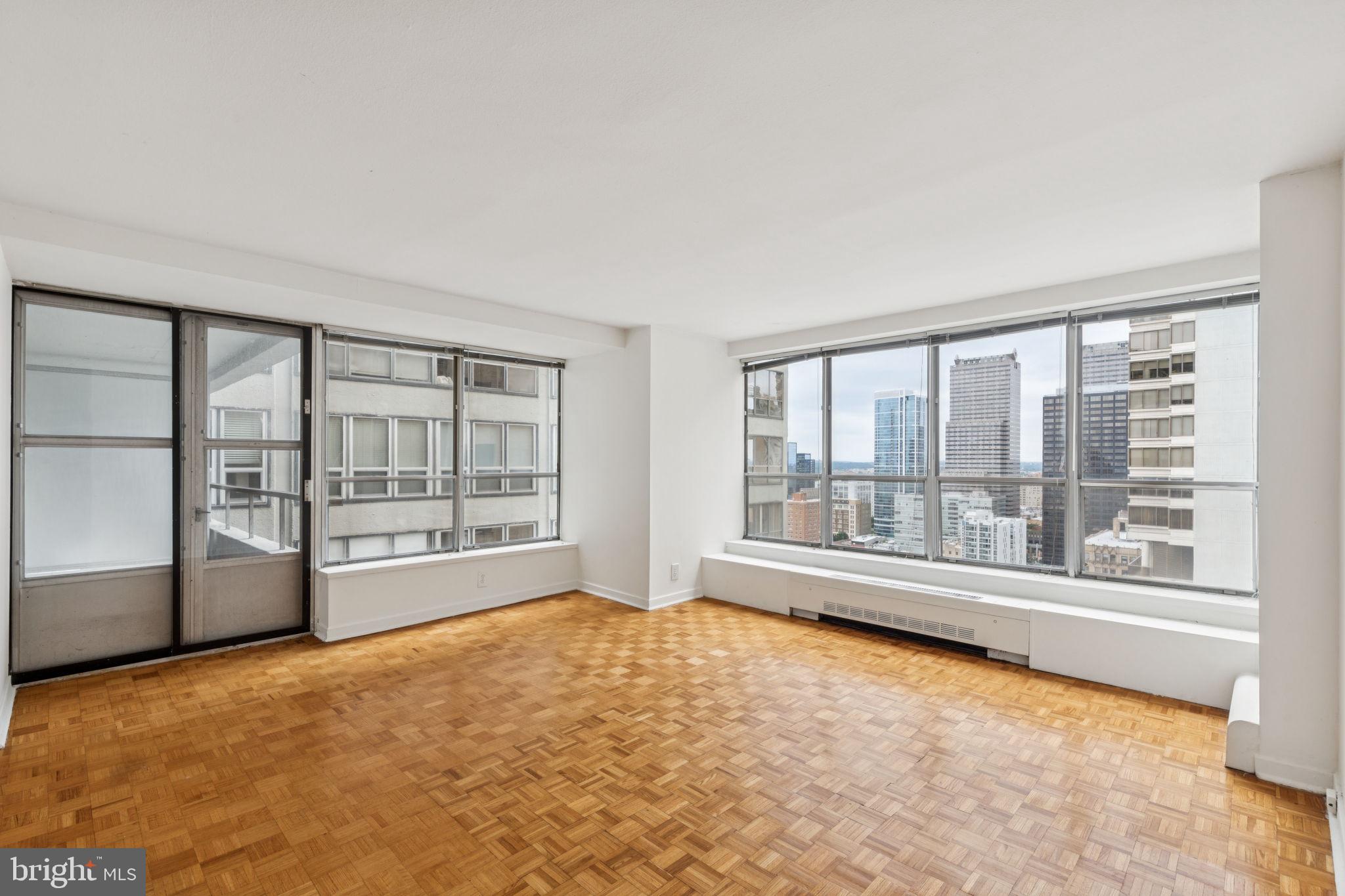 Spacious and light-filled two bedroom home with a private balcony on a high floor of The Dorchester! This home features a large great room with ample space for living, dining, and entertaining as well as access to the private north-facing balcony showcasing city views. Adjacent, the tastefully updated kitchen features modern wood cabinetry, upgraded countertops, tile backsplash, stainless steel appliances, and a tile floor. The generously sized primary bedroom has a walk-in closet and ensuite bath with glass enclosed stall shower, single vanity, and marble tile floor. Adjacent, there is a second bedroom with a wall closet that enjoys use of a full hall bathroom with wooden vanity, tub shower, marble tile floor, and stacked washer/dryer. Additionally, the home has excellent storage space and parquet wood floors throughout. Residents of The Dorchester enjoy a twenty-four-hour doorman and all utilities included in rent except cable TV. Use of the building's state-of-the-art fitness center, seasonal rooftop pool club, and valet parking in the building's underground garage are available for an additional fee, subject to availability. No pets permitted. Rittenhouse Square is ranked the 6th best neighborhood in North America with 175 restaurants and 199 retailers within a three block radius. The Dorchester is within walking distance to the Market Street office corridor, The Avenue of the Arts and University City. 30th Street Station and Philadelphia International Airport are a short commute.