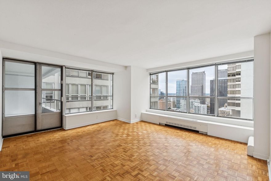 Spacious and light-filled two bedroom home with a private balcony on a high floor of The Dorchester! This home features a large great room with ample space for living, dining, and entertaining as well as access to the private north-facing balcony showcasing city views. Adjacent, the tastefully updated kitchen features modern wood cabinetry, upgraded countertops, tile backsplash, stainless steel appliances, and a tile floor. The generously sized primary bedroom has a walk-in closet and ensuite bath with glass enclosed stall shower, single vanity, and marble tile floor. Adjacent, there is a second bedroom with a wall closet that enjoys use of a full hall bathroom with wooden vanity, tub shower, marble tile floor, and stacked washer/dryer. Additionally, the home has excellent storage space and parquet wood floors throughout. Residents of The Dorchester enjoy a twenty-four-hour doorman and all utilities included in rent except cable TV. Use of the building's state-of-the-art fitness center, seasonal rooftop pool club, and valet parking in the building's underground garage are available for an additional fee, subject to availability. No pets permitted. Rittenhouse Square is ranked the 6th best neighborhood in North America with 175 restaurants and 199 retailers within a three block radius. The Dorchester is within walking distance to the Market Street office corridor, The Avenue of the Arts and University City. 30th Street Station and Philadelphia International Airport are a short commute.