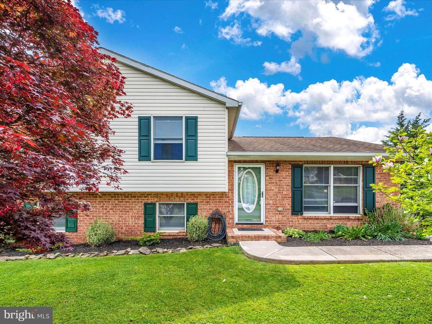 Lovely, freshly painted,  split level with 3 bedrooms, 2 full baths, a rough in for a 3rd in the lower level storage area.  Living room, dining area in Kitchen.  Good size family room in lower level with Laundry room and possible 4th bedroom, or office/den.  On a 1/4 acre of land.  Fenced yard. Off street parking.