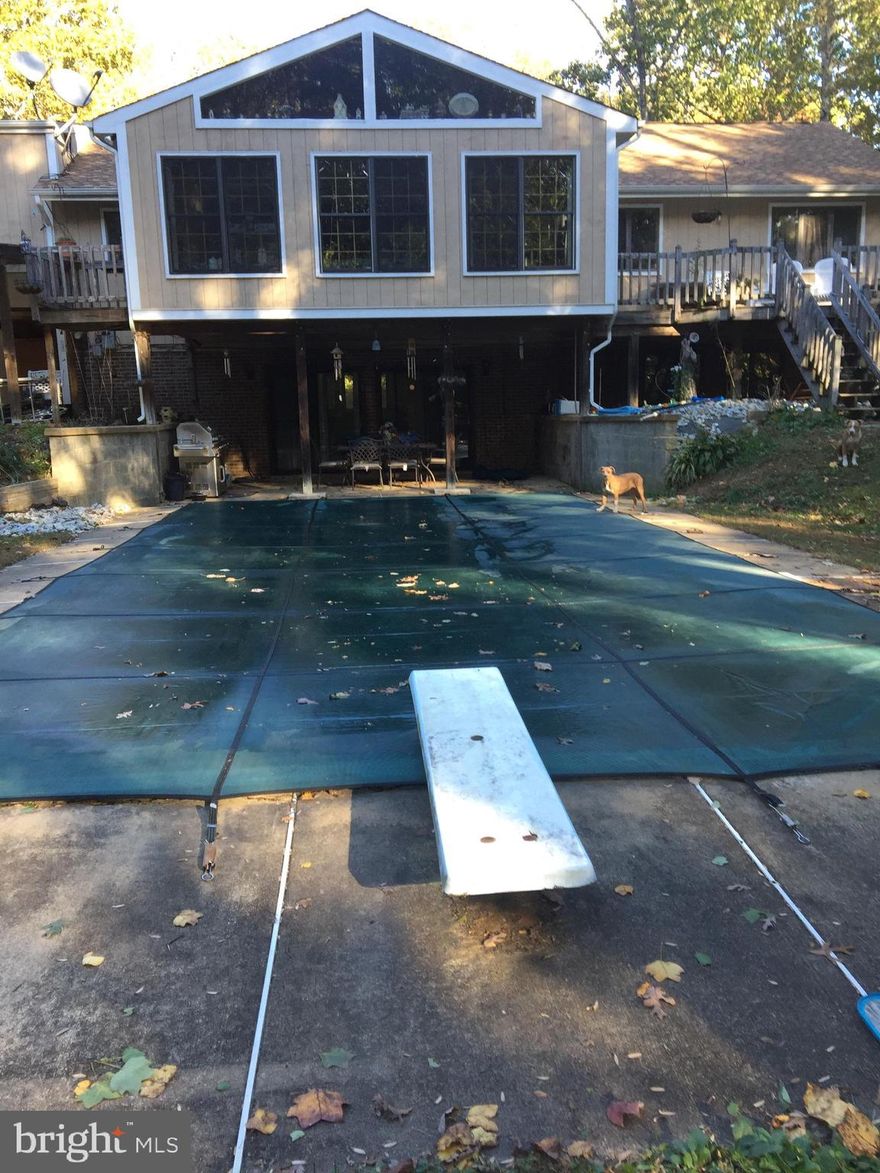 Beautifully secluded home on almost 5 acres, Large open floor plan with two stories. Two pellet stoves to extra heat in the winter. Formal living and dining room on main level with a amazing sunroom that opens to a deck and overlooks the inground pool. Basement is finished with wet bar, den, pool room, and bedroom. Big two car garage with finished walls and wired for 220. Master suite with his and her dressing rooms. Video cameras in use inside & out.

Schedule showings through Showtime,  Sentrilock box at front door