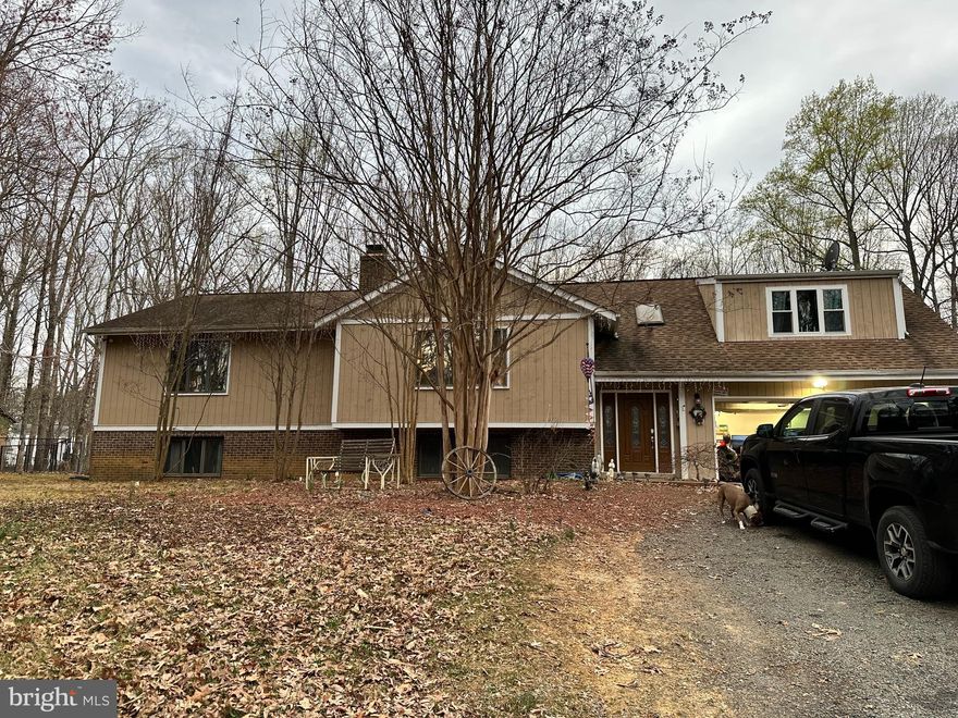 Beautifully secluded home on almost 5 acres, Large open floor plan with two stories. Two pellet stoves to extra heat in the winter. Formal living and dining room on main level with a amazing sunroom that opens to a deck and overlooks the inground pool. Basement is finished with wet bar, den, pool room, and bedroom. Big two car garage with finished walls and wired for 220. Master suite with his and her dressing rooms. Video cameras in use inside & out.

Schedule showings through Showtime,  Sentrilock box at front door