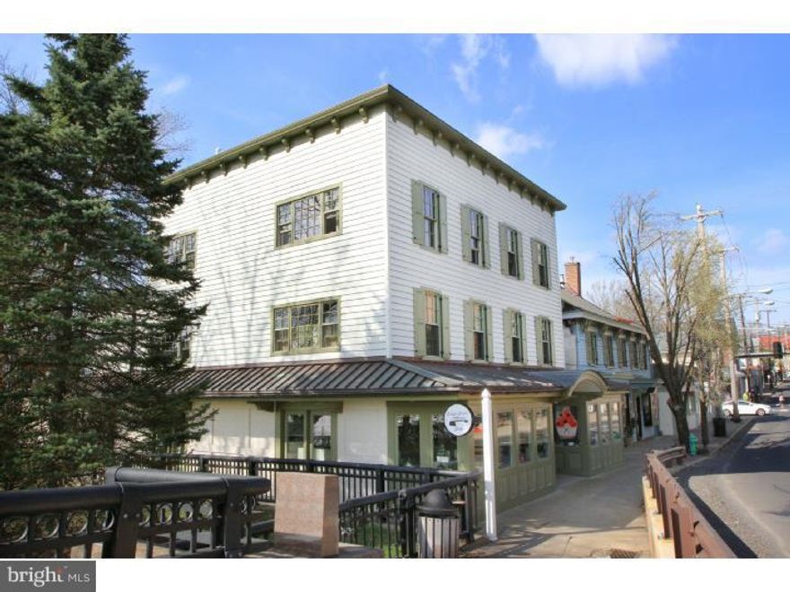 Beat the market for the return on your investment: this landmark building is in the heart of downtown New Hope, riverfront with bridge views and the best foot and vehicle exposure available. Mixed commercial/residential, the building is fully occupied and has been for years, just collect the rents and make an est. 7% CAP. Recently renovated building needs nothing and has room to grow, a perfect example of investment potential. Two long term commercial tenants anchor the first floor, upstairs are four apartments with longterm tenants. A tidy common area overlooks the Delaware River and the bridge to Lambertville. Approvals were previously granted for a 750 sq ft commercial addition, a re-application for such a project is possible for more commercial sq ft. A great property to capitalize on your arm's length investment, become an owner-occupant, or expand and increase the rent potential and maximize profit.  Public water & sewer, gas from the street is separately metered, tenants pay most utilities.  Adjacent open space parcel (with sculpture) is owned by bridge commission and is fenced from the public, plenty of buffer for the premium apartment views of the river.