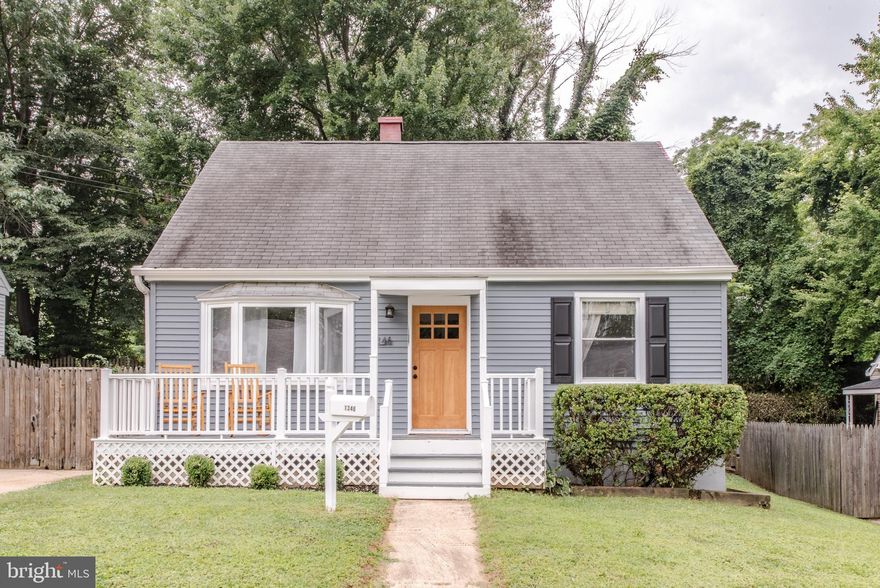Nestled in the charming Sudbrook Park neighborhood, this delightful Cape Cod home with a front porch exudes warmth and comfort.  Step inside to discover a traditional floor plan that flows seamlessly, featuring central air, beautiful crown moldings and rich wood floors that create an inviting atmosphere. The eat-in kitchen is a culinary delight, equipped with upgraded countertops and stainless steel appliances, perfect for both casual meals and entertaining. Enjoy the convenience of a main-level bedroom plus a 2nd bedroom and an updated full bath. The upper level boasts a wonderful primary bedroom & a huge walk-in closet that was originally the 3rd bedroom. The lower level family room offers additional space for recreation or relaxation. There is another full bath on this level too. Outside, the fenced rear yard provides a serene backdrop, with a deck, ideal for enjoying morning coffee or evening gatherings. The property backs to trees, ensuring privacy and a peaceful ambiance. Parking is a breeze with a concrete driveway accommodating two vehicles, and a shed offers extra storage for gardening tools or outdoor equipment. This home is not just a place to live; it’s a place to create lasting memories. Experience the perfect blend of comfort and style in this inviting residence. Furnace replaced 2016. (PHOTOS ARE FROM PREVIOUS LISTING)