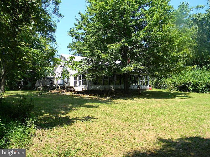 Beautiful Setting on a corner lot for this one level living home in Front Royal. Close to town yet private. It also boasts one of a kind features!  Corner lot. Great Investment or Make it Your Own Getaway! Two Car Garage, deck, sunroom, lush lawn with mature trees, privacy yet minutes to town.  Great location. Discoloration on wall and ceiling. Priced to Sell. As Is