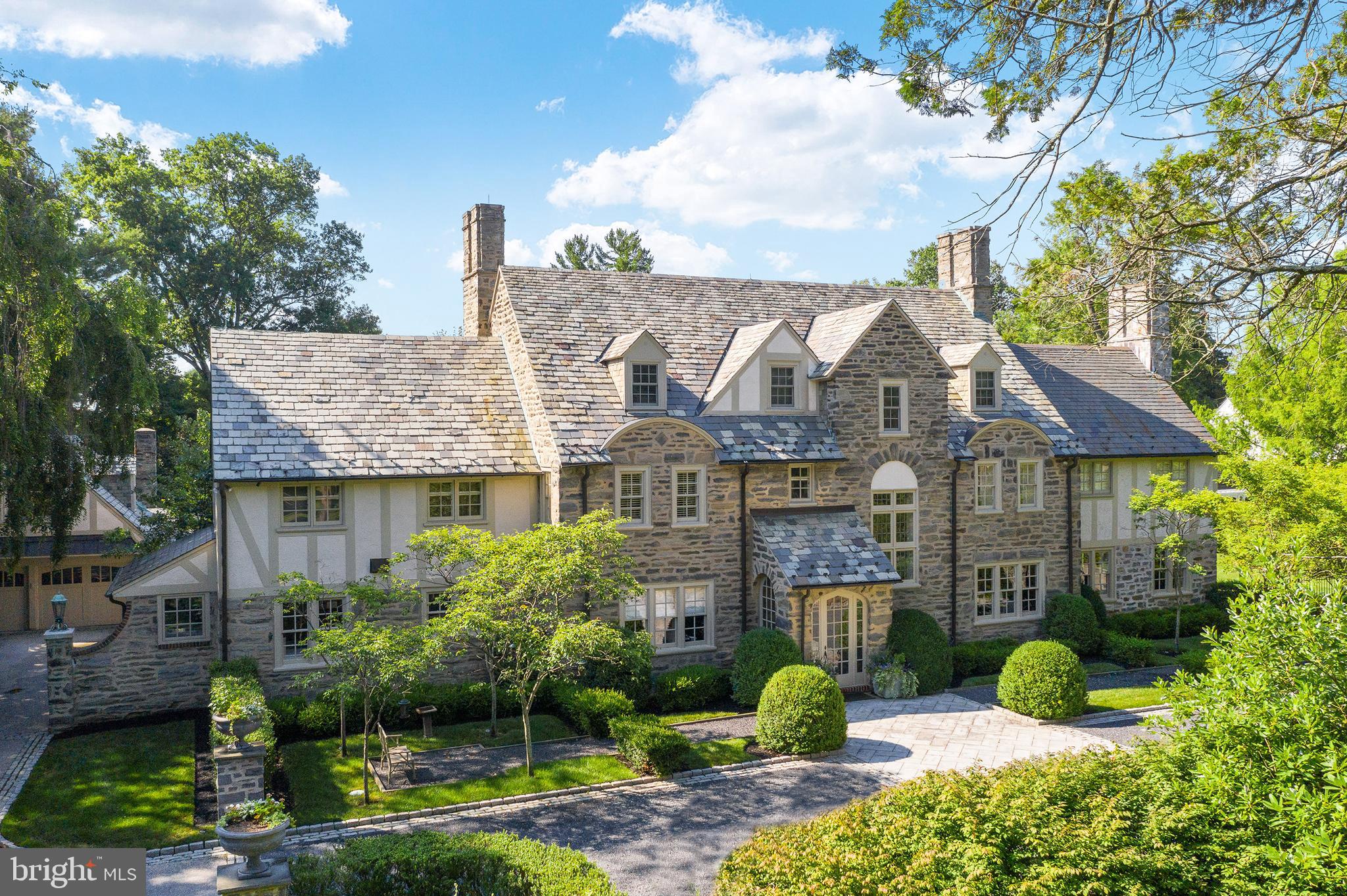 Welcome to this breathtaking, gated residence with entrance courtyard majestically set on over an acre of stunning Gale-designed grounds and gardens in the highly coveted Merion Golf neighborhood. The impeccable interior and exterior renovations and masterful expansion of this sun-filled 1920's stone Normandy home including a fabulous pool with spa, English pool house with full bathroom and Joanne Hudson kitchen, and charming 4-car carriage house with potential living space above, will please the most discriminating buyer at every turn. Move right in and enjoy the very private setting with gracious room sizes for comfortable living and effortless entertaining, an open flow, high ceilings, beautifully restored original floors, millwork, moldings and architectural details, incredible Joanne Hudson chef's kitchen with La Cornue cooktop and hood, double Wolf wall ovens, Sub-zero refrigerator, freezer and drawers, large family room expansion with bright widows and French doors leading out to the private terraces and grounds, inviting Master Bedroom Suite addition with luxurious marble bath and his and hers dressing rooms, 4 additional spacious bedrooms with 2 beautifully renovated en-suite baths and one hall bath, artistically designed exterior terraces and a new expansive entertaining loggia with stone fireplace. This timeless treasure offers a peaceful retreat while also being located just minutes away from trains, world class shopping and restaurants, Center City Philadelphia, renowned schools, recreational facilities, Philadelphia International Airport and 90 minutes from New York City.***Walkthrough video at: https://www.seetheproperty.com/r/355456***
