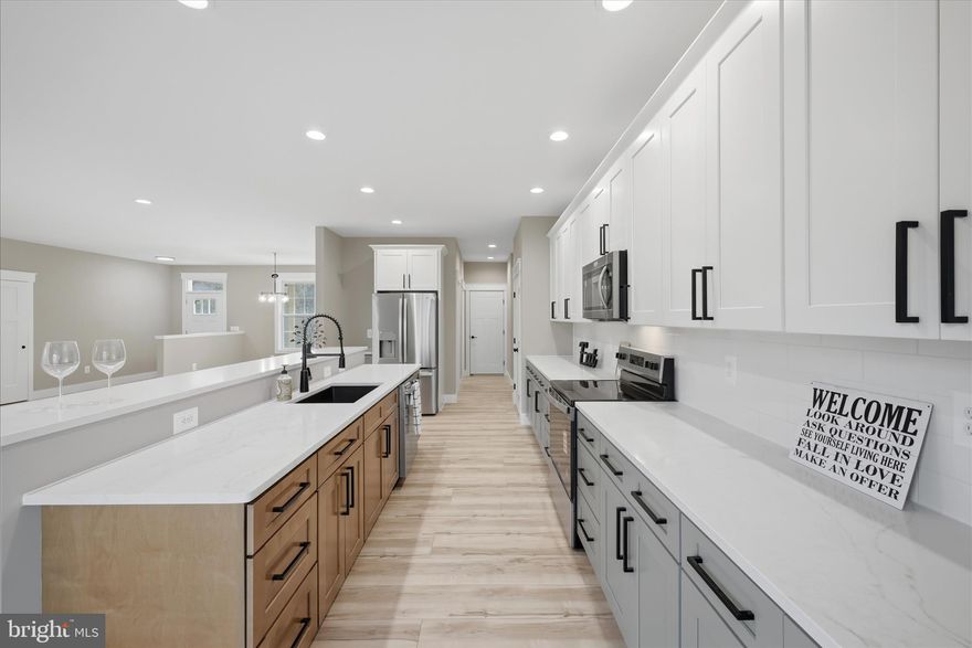 2.5 private acres offering one-level living in a peaceful, tree-filled setting. This thoughtfully designed home features an open floor plan with 9-ft ceilings throughout, custom trim work, solid wood doors and luxury vinyl plank flooring throughout the entire home.
The spacious kitchen is a standout with quartz countertops, upgraded three-tone cabinetry, a large island, and pantry, perfect for entertaining or everyday living. Flexible space can be used as a formal dining room or home office.
All bedrooms are generously sized and include walk-in closets, while the bathrooms also feature quartz countertops for a cohesive, high-end finish.
Enjoy the outdoors from the covered front and back porches, surrounded by mature trees and a quiet setting. The insulated, painted, and finished garage includes a 16x8 garage door and adds extra functionality and comfort. A perfect blend of modern finishes, privacy, and convenience—this home is ready to impress.
