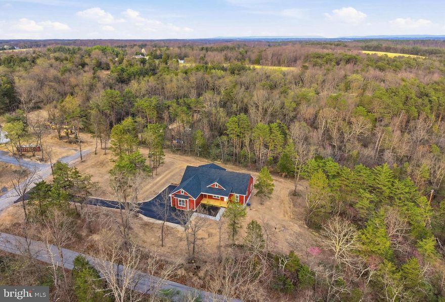 Beautiful new construction home on 2.5 private acres offering one-level living in a peaceful, tree-filled setting. This thoughtfully designed home features an open floor plan with 9-ft ceilings throughout, custom trim work, solid wood doors and luxury vinyl plank flooring throughout the entire home.
The spacious kitchen is a standout with quartz countertops, upgraded three-tone cabinetry, a large island, and pantry, perfect for entertaining or everyday living. Flexible space can be used as a formal dining room or home office.
All bedrooms are generously sized and include walk-in closets, while the bathrooms also feature quartz countertops for a cohesive, high-end finish.
Enjoy the outdoors from the covered front and back porches, surrounded by mature trees and a quiet setting.
The insulated, painted, and finished garage includes a 16x8 garage door and adds extra functionality and comfort.
A perfect blend of modern finishes, privacy, and convenience—this home is ready to impress.