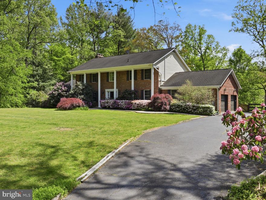 Fairfax Station’s finest!!
Get ready to live LARGE in this Stunning 5-bedroom, 4.5 bath home on 5 private acres located at the end of a cul-de-sac in the Smoke Rise community.
You get Hardwood floors on the main and upper levels. The oversized family room w/wood burning fireplace has built ins and leads to the expansive rear deck overlooking the private, wooded setting. 
The kitchen is the Heart of this Home. It’s been fully renovated and features a giant center island, quartz countertops, stainless steel appliances, farmhouse sink, abundant custom cabinetry, large pantry and a wall of windows overlooking the outdoors. No expense was spared! 
The formal dining room is situated right off the kitchen for easy entertaining. 
The main level also features a very large bedroom that could be used as a Primary Suite. It has a wood burning fire place and an en suite bath. It's ideal for multigenerational living or an au pair suite.  Main level laundry, half bath plus a breakfast nook too! 
On the upper level, the Primary suite is HUGE! It has a large sitting room/office off the bedroom plus a double sized walk in closet. Primary bath has soaking tub,  walk in shower and double sinks. 
Three other big bedrooms on the upper level w/lots of closet space. 
Upper level full bath has been updated with/ceramic tile and a tub/shower. 
On the lower level you get another fireplace with a large recreation room w/kitchenette, game room, exercise room plus another full bath and large storage area. 
Lower level washer and dryer DO NOT convey. 
Bring your horses -- this home has the perfect lot for it.  Six stall barn with water and electricity,  riding ring and paddock. 
There's also a creek at the edge of the property that's nestled under a canopy of trees.
LARGE exterior deck that overlooks the expansive rear yard and a BIG play set that conveys. 
Lush landscaping including 2 mature Japanese maples, a butterfly tree and more!
Two car side load garage provides even more storage. 
This home is close to the charming town of Clifton, all the major commuter routes, the Burke VRE, shopping and so much more. 
If you’re looking to live LARGE, don’t miss this one!!