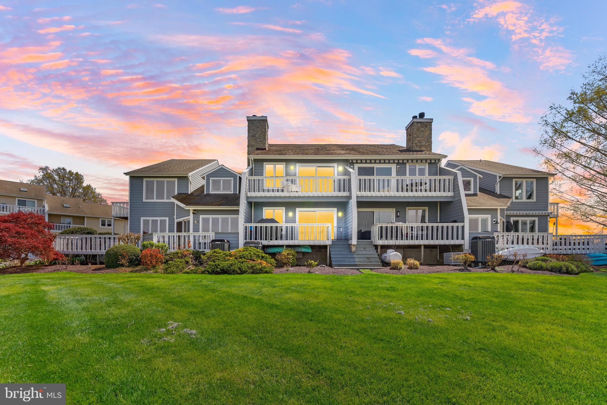 Welcome to 121 Bayview Drive—Where Waterfront Living Meets Everyday Luxury
Perfectly positioned with panoramic views of the Chester River and Chesapeake Bay, this 3-bedroom, 3.5-bath coastal townhome offers the ideal blend of comfort, charm, and convenience. Whether you're sipping coffee from one of your three private outdoor spaces or toasting the 4th of July fireworks with friends on the balcony, life on the water here feels effortless.
Inside, you'll find over 2,000 sq ft of living space with a bright, open-concept layout and thoughtful upgrades throughout—granite countertops, stainless steel appliances, stone-surround fireplace, custom built-ins, wainscoting, fresh paint, and stylish fixtures.
The private primary suite features cathedral ceilings, two closets (including a walk-in), a spa-like en suite bath with soaking tub and sit-down vanity, and its own waterfront balcony—the perfect end-of-day retreat.
Need space for guests or a home office? Each bedroom is on its own level, offering privacy and flexibility.
Outside, this home comes with its own deeded boat slip, plus access to a community pool, green space, and unbeatable proximity to all your favorite Eastern Shore waterfront spots—Kent Narrows, St. Michaels, Annapolis, and beyond.
Whether you’re looking for a weekend getaway or full-time waterfront lifestyle, 121 Bayview is your chance to live the Maryland dream. Let’s make the shore your home.