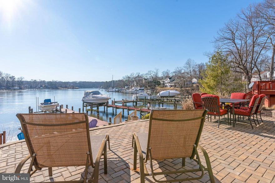 Must See!  Completely renovated 3 bed/4 bath WATERFRONT  colonial with partially finished basement.  Hardwood floors throughout main floor, new kitchen, baths (2018) Stunning views and a 50ft pier with a boat lift. Step outside to an entertainers delight!  Custom patio with fire pit, almost maintenance free yard, and a voluntary HOA w/ a community beach/pier/boat ramp