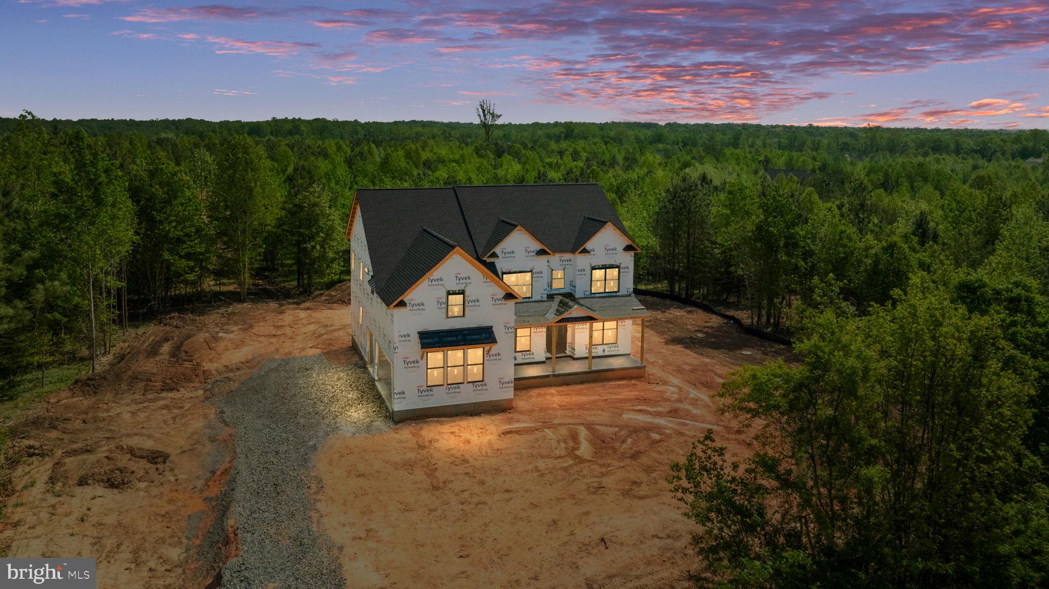 BACK ON THE MARKET through no fault of seller! CUSTOM HOME WITH AUGUST DELIVERY!
Located in the prestigious Fortunes Landing estate community, this custom home seamlessly blends luxury, functionality, and superior craftsmanship. The exterior showcases a combination of Hardie Plank siding and a timeless Board and Batten front elevation. A spacious 3-Car Garage provides plenty of room for vehicles, while the expansive Deck with Trex Enhance flooring and White Vinyl Rails creates an ideal setting for outdoor relaxation and entertaining. Inside, the main floor features a Powder Room, a Home Office, and a Playroom, perfect for family living. The Great Room is highlighted by a stunning Fireplace with a Cedar-wrapped Mantel and Quartz base, adding a touch of elegance. Upstairs, the thoughtfully designed layout offers four generously sized bedrooms and four bathrooms. The luxurious Owner’s Suite includes a Tray Ceiling and a Frameless Shower Door. The Laundry Room is ideally situated upstairs, near all the bedrooms, and is equipped with cabinets and a sink. The impressive basement includes a large Recreation Room, a cozy Den, a Full Bathroom, and a Walkup Condition, offering easy access to the outdoors.
Upgrades throughout the home include a Dual Fuel HVAC System, Black Gutters, Pella Windows, and high-end THERMADOR appliances. French doors lead to both the Playroom and Home Office, while the garage is equipped with a 240-volt outlet and a keypad for convenience. A Flagstone Front Porch and Craftsman Trim further enhance the home's appeal.
Sitting on a 5.24-acre lot, this property offers the perfect balance of privacy and community. Fortunes Landing boasts a scenic walking and biking trail, as well as a beautiful nature park along the Ni River Reservoir, giving residents easy access to nature and outdoor recreation right outside their door. With its combination of high-end finishes and thoughtful design, this custom home delivers an exceptional living experience in a highly sought-after location.
The community is conveniently located near Old Town Fredericksburg, Mary Washington Hospital, Spotsylvania Regional Medical Center, the Virginia Railway Express, Spotsylvania Towne Centre, Central Park Shopping Center, local farmers markets, national parks, battlefields, wineries, Publix, and Wegmans, with easy access to I-95. Don’t miss the opportunity to own this exquisite property in Fortunes Landing, where luxury living meets the beauty of nature, offering a retreat-like lifestyle.
Some photos are for illustrative purposes only (house under construction) Click on virtual tour to view the actual property and preliminary photos.
Ask about the July Builder incentive 2/1 Buy down program! Save money on the first two years of your loan!
Prices & Incentives are subject to change without notice!