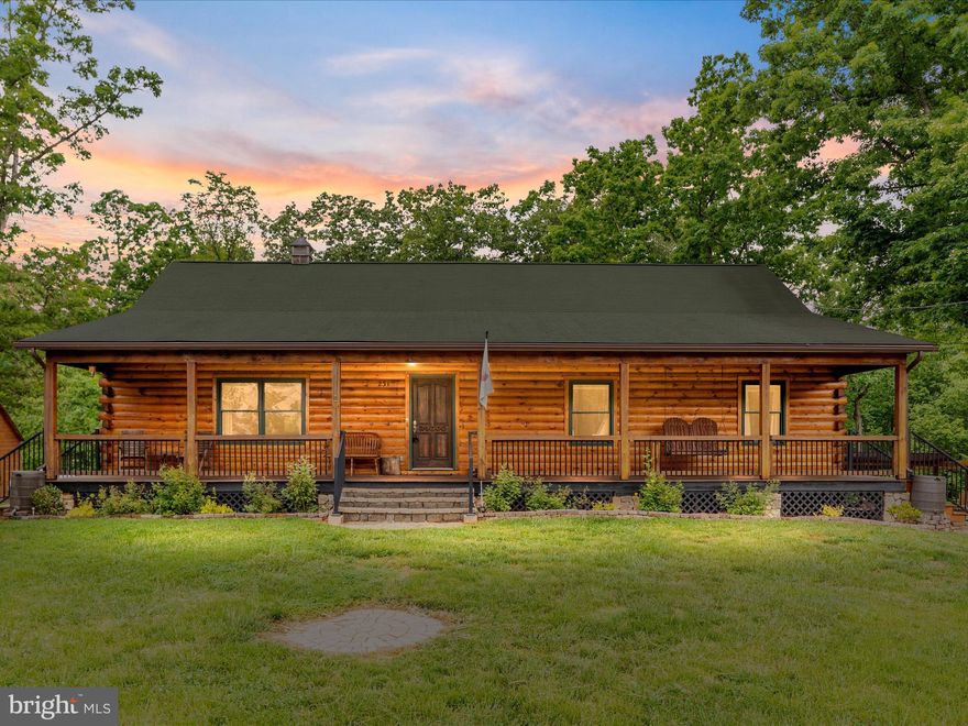 Charming Log Home on 3 Acres Just Minutes from Town

Have you been dreaming of a log cabin retreat that offers the perfect blend of privacy, comfort, and convenience? Nestled on 3 beautifully wooded acres, this custom log home offers a true sense of mountain living, just a short drive from town.

Step inside to discover a warm and inviting interior featuring an open floor plan with cathedral ceilings, rich hardwood floors, and a cozy gas fireplace that anchors the spacious living room. The kitchen boasts elegant cherry cabinetry, ample counter space, and a seamless connection to the main living areas—perfect for entertaining or enjoying quiet evenings at home.

With 3 bedrooms and 2 full baths, this home provides comfortable accommodations for family and guests. The primary suite offers peaceful views and a relaxing retreat at the end of the day.

Step outside and enjoy the large covered front porch—ideal for morning coffee or watching the sunset—or head to the expansive back deck, perfect for hosting cookouts or soaking up the tranquility of nature. A designated area with a hot tub and fire pit invites you to unwind under the stars.

The detached 936 sq ft garage provides excellent space for vehicles, a workshop, or additional storage. The property is beautifully landscaped and surrounded by mature trees, offering privacy, seasonal mountain views, and a peaceful, natural setting.

Whether you’re seeking a full-time residence or a weekend getaway, this one-of-a-kind log home has it all.

The following improvements have been made: New septic 2023, updated well pump 2023, new jacuzzi 2024, new water tank  2023, two outside water spigots installed 2023, and the porch, deck, and garage have been stained/waterproofed 2025.