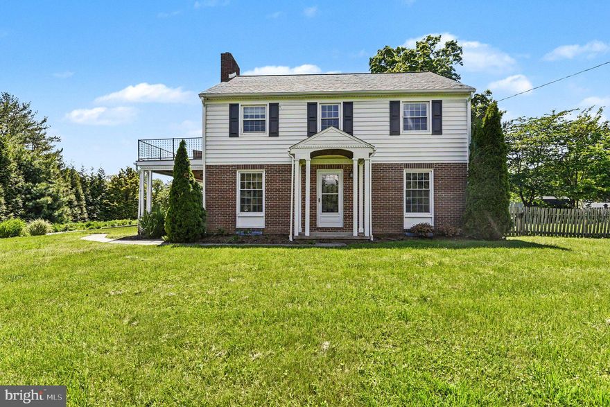 Classic charm meets timeless elegance in this beautifully updated home! From the moment you step inside, you’ll appreciate the character, warmth, and spacious rooms rarely found in today’s homes. The bright and inviting first-floor layout features an open living room highlighted by a stunning staircase, while the open kitchen and dining area create the perfect setting for gatherings and everyday meals.  A charming powder room showcases a custom walnut countertop and vessel sink, adding unique style and character. An appealing arch leads you into the large, light-filled mudroom offering four huge built-ins cubbies, pantry and coat storage, and sliding door access to the side patio—ideal for entertaining. (Side property line extends approximately to the edge of the patio.) The attached garage includes a convenient utility sink.  Upstairs, you’ll find generously sized bedrooms, including one with access to a spacious balcony. The walk-up attic provides excellent storage or the opportunity to create a bonus room, office, or studio space.  The finished basement is designed for both entertaining and organization, featuring beautiful built-ins and convenient exterior stair access from the mechanical room. Two additional electric sub panels make finishing the attic or installing an electric vehicle charger a snap.  Outside, the expansive front yard with large privacy trees, side entertaining area, and illuminated circular driveway with ample parking complete this landmark property you’ll be proud to call home.