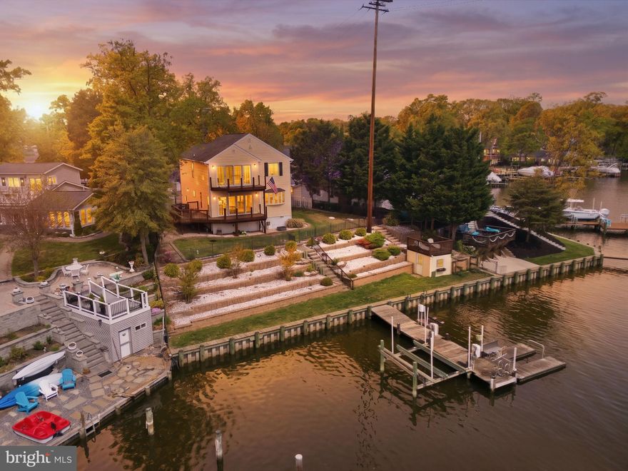 Waterfront living doesn't get better than this. With 100 feet of prime shoreline, deep water access, and a fully outfitted pier featuring a 10,000 lb boat lift and jet ski lift, this property was made for people who live on the water. A floating kayak launch, kayak racks, and a charming crab deck/boathouse complete the waterfront experience, while the 2023 bulkhead replacement means you can enjoy it all with total peace of mind.
The grounds have been thoughtfully elevated with a new four-tier stone retaining wall and fresh landscaping that balance beauty with function. The deck with glass panel railing lets the water views take center stage — unobstructed, uninterrupted, and absolutely breathtaking. Step inside and the open floor plan opens up around hardwood floors, a kitchen with granite countertops and a newer refrigerator, and a generous primary suite with a spa-style bath and newer four-door slider that connects seamlessly to the outdoors. A one-car garage with workshop space rounds out the practicality.
And the perks extend beyond your property line, including community amenities such as a private beach and boat ramp, offering even more ways to get on the water.
If you've been waiting for the one that checks every box, this is it. Come see it for yourself, and start loving being home.