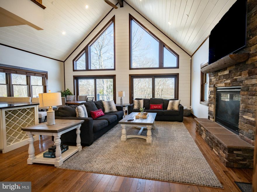 267 Woodlands Hill Lane offers mountain living at its finest! This custom, 2021 built chalet is designed for ultimate comfort and enjoyment. The mountain setting offers breathtaking views with a location close to all of the areas most desirable amenities. Offering 4 bedrooms, 3.5 bathrooms and 3 levels of living, this home offers plenty of room for entertaining guests. You'll be greeted with oak hardwood floors throughout the main level of the home. The kitchen offers premium stainless appliances, granite countertops and an eat-in breakfast bar. There are two gas fireplaces, one upstairs and one down. The lower level offers an expansive living area with game room and wet bar. An expansive deck terraces across the main level and lower level of the exterior. Plenty of room for storing toys or parking vehicles in the 2 car detached garage! Whether you are looking for a primary residence, second home or vacation rental, this home offers many of the features you desire in today's market! Call today to schedule a private showing!