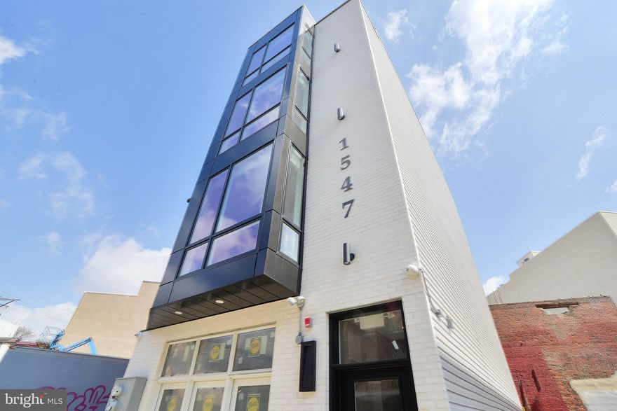 Welcome to 1547 Ridge Ave in the heart of Francisville s booming commercial corridor. Built and developed by one of the neighborhoods leading developers, The Stamm Development Group. This 4,500 sq ft, 20 ft wide, four story new construction property features NET OPERATING INCOME of approximately $72,000, with roughly 9 years left on the tax abatement, a ground floor and basement commercial unit, and two residential units, with the potential to condo and sell separately in the future, this property is a must see! This commercial mixed use building has standpipes, a commercial sprinkler system, french drains, sump pump, Pella windows, Cat 6 wiring, Cameras, an Aiphone entry system, and a 2.5 foot easement on the right side of the building making trash storage easy. The first floor commercial unit is currently occupied on a 5 year NNN lease bringing in $2000/month plus $200/month in cost sharing through the NNN. It has access to a fully finished basement and private backyard. The bi level residential units on floors two through four, feature marble backsplashes, quartz waterfall countertops, 42 Inch Milan Shale Cabinetry, upgraded GE stainless steel appliances with gas cooking, central air/heat, white slatted Woodland blinds, Nest Thermostats, scratch resistant vinyl plank flooring, 7  video monitors, 9-10 ft ceilings, marble vanities in the bathrooms, and custom closet systems in every bedroom. No expenses were spared! Unit 1 is a 2 bedroom, 2.5 bathroom currently being rented at $2000/month. Unit 2 features sweeping views of Center City from a private roof deck, as well as 2 bedrooms, 2.5 bathrooms presently rented at $2318/month. Lease for Unit 2 expires 6/30/2021. Don t miss your opportunity to get in at the ground level of this developing corridor! Reach out for a private showing today!