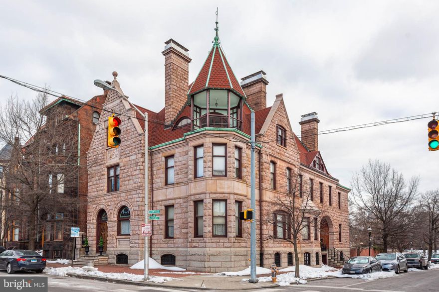 Truly a rare architectural treasure, the newly restored Hawley-Hutzler House stands as one of Bolton Hill’s most distinguished Victorian landmarks. Encompassing over 8,200 square feet across four finished levels, this extraordinary residence is a masterclass in 18th-century design — thoughtfully restored to celebrate its historic integrity while accommodating modern living.  From the moment you arrive, the home’s commanding façade, ornate stonework, and stately presence set the tone for what awaits inside. Elaborate cornices, several historic stained glass windows, intricate brick detailing, and a dramatic entry reflect the grandeur synonymous with Baltimore’s Gilded Age. Within, the scale and craftsmanship are nothing short of breathtaking — soaring ceilings, sweeping proportions, hand-carved woodwork, original plaster moldings, working and decorative fireplaces, and oversized windows that flood the interiors with natural light.  Configured as four legally zoned residential units, the property offers exceptional flexibility without compromising architectural character. The expansive owner’s residence showcases the mansion’s most magnificent spaces — grand parlors designed for formal entertaining, richly detailed millwork, hardwood flooring, period mantels, and refined architectural embellishments that honor its storied past. Three additional rental residences are seamlessly integrated within the structure, preserving historic detail while providing a sophisticated income-producing component.  The rear grounds offer a rare urban sanctuary. Enclosed by a 48'x45', 7-foot walled garden featuring perennials and native plants, the expansive backyard provides space for outdoor entertaining, or quiet reflection. Backing directly to the 2.9-acre Arnold Sumpter Park, the setting enhances the estate’s sense of openness and historic prominence.  A true architectural legacy property — combining scale, craftsmanship, historic pedigree, and income potential — the restored Hawley-Hutzler House represents one of Bolton Hill’s most significant offerings.