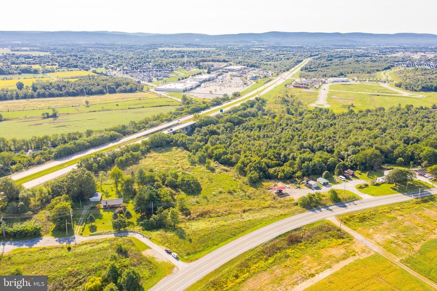 This 3.65 acre lot is multi zoned including Highway Commercial. Perfectly located situated between WV-115 and Rt. 9/340 bypass. Don't miss out on this great opportunity.