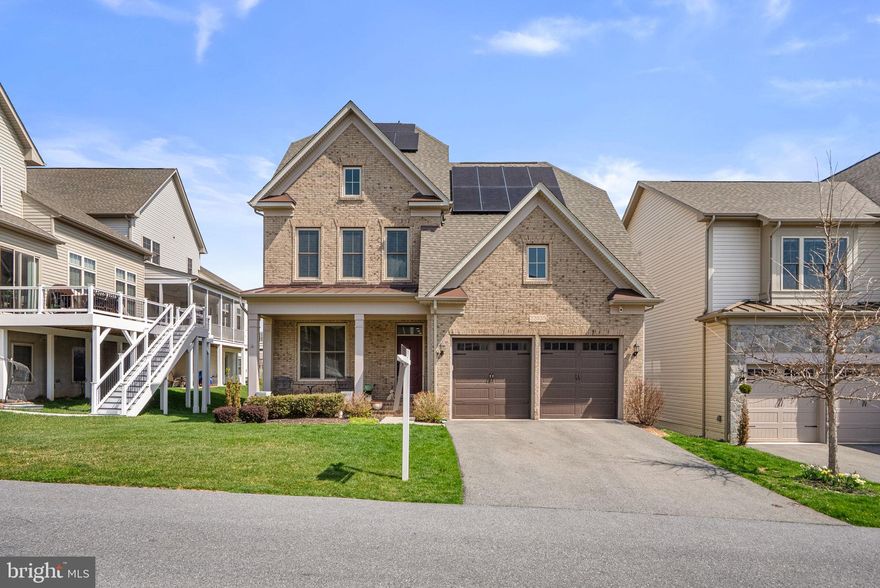 Set on one of the largest and most private lots in the community, this exceptional 2020-built residence offers a rare blend of sophistication, comfort, and modern design in sought-after Clarksburg, Montgomery County. Featuring 4 bedrooms, 4.5 bathrooms, and a two-car garage with a semi-private drive, this home is thoughtfully designed for both elegant living and effortless entertaining.

A welcoming main level showcases a private office and an expansive open-concept floor plan. At the heart of the home, the designer kitchen impresses with a grand granite island, custom hood, and generous dining space, flowing seamlessly into a beautifully appointed living room anchored by a striking stone fireplace. Walls of windows invite in natural light while framing serene wooded views, creating a sense of privacy and tranquility. A screened-in balcony offers a refined outdoor retreat.

The walk-out lower level is an entertainer’s dream, complete with a full bath, abundant storage, and a custom-crafted bar with dedicated refrigeration. The outdoor living experience continues with a wraparound stone patio, perfect for hosting or unwinding in a peaceful setting.

Upstairs, four spacious bedrooms include two en-suite retreats and an additional full bath. The luxurious owner’s suite features dual walk-in closets and a spa-inspired bath with dual vanities, a soaking tub, and an oversized custom shower.

Ideally located near parks, top-rated schools, and major commuter routes including I-270, with premier shopping and dining at Clarksburg Premium Outlets just minutes away. Impeccably maintained and elegantly appointed, this home represents the pinnacle of modern suburban living.