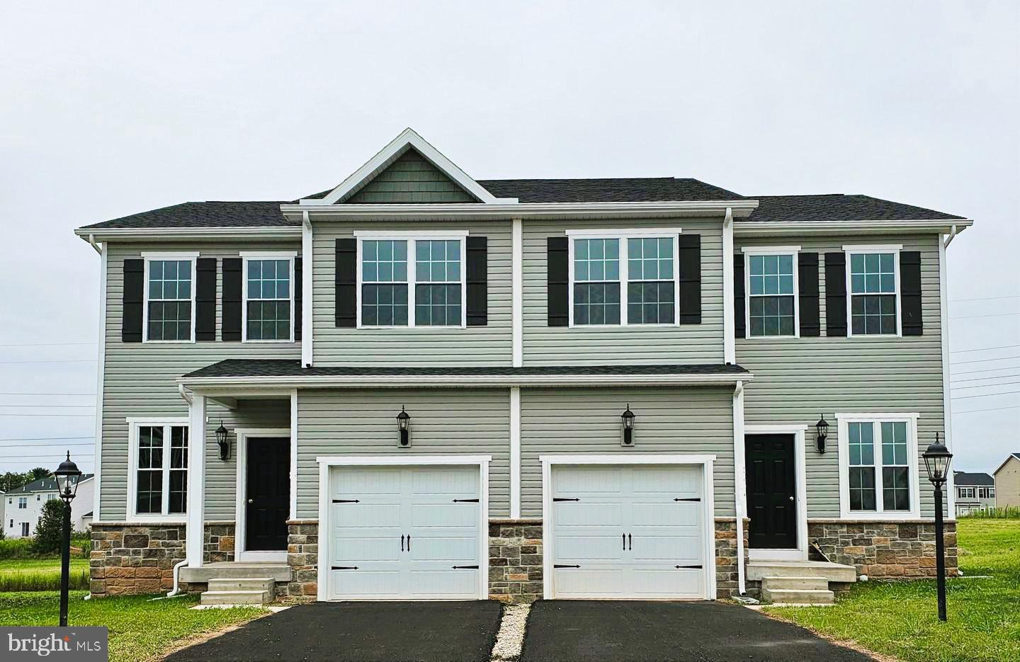 Up to $17,000 Incentive when using builder preferred lender and title. To Be Built – The Kendall at King’s Court at Brownstone Manor- No home is currently constructed—buyers have the opportunity to personalize selections and design features.
Step into the KENDALL—a beautifully designed duplex that combines modern functionality with timeless style, ideally located near local amenities. Perfect for first-time buyers or those seeking an affordable, stylish home.
This unit features a 1-car garage and a Optional basement for added space and convenience. Inside, enjoy an open flex space flowing into the kitchen with an island, granite countertops, pantry, and 36" painted cabinets with crown molding. A 6' sliding door and 9' ceilings on the main floor enhance the open feel. Stainless steel appliances include a flat-top range, built-in microwave, dishwasher, and disposal.
The spacious Owner’s Suite offers a walk-in closet and private bath with a 5' shower and seat—designed for comfort and style.
Natural gas heat, public water and sewer, and energy-efficient construction round out this fantastic home.