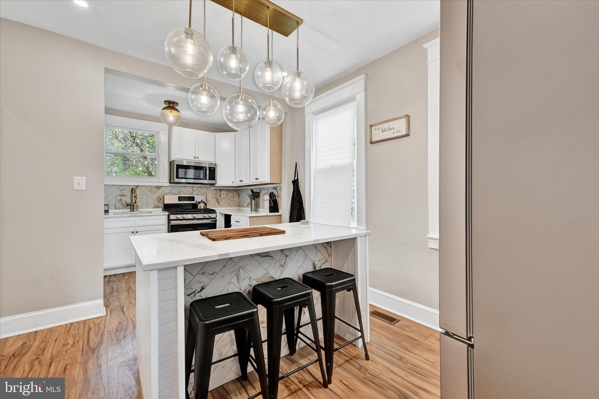 Please note this weeks open house has been cancelled. Ask about the assumable 5% FHA loan! Welcome home to this beautiful property in the Waltherson neighborhood. With three ample size bedrooms, and two full bathrooms, there is plenty of room to relax. The elegant modern light fixtures throughout are design elements of envy. The kitchen is any would be chef's dream, with a convenient center island to gather around and enjoy. Enjoy summer nights sipping on your favorite summer beverage on your screened in back porch. With plenty of yard space, and long driveway, this home has all the conveniences you could want. The roof, windows, Central HVAC, water heater, and appliances were all replaced in 2022, so there is added peace of mind. Book your showing today!