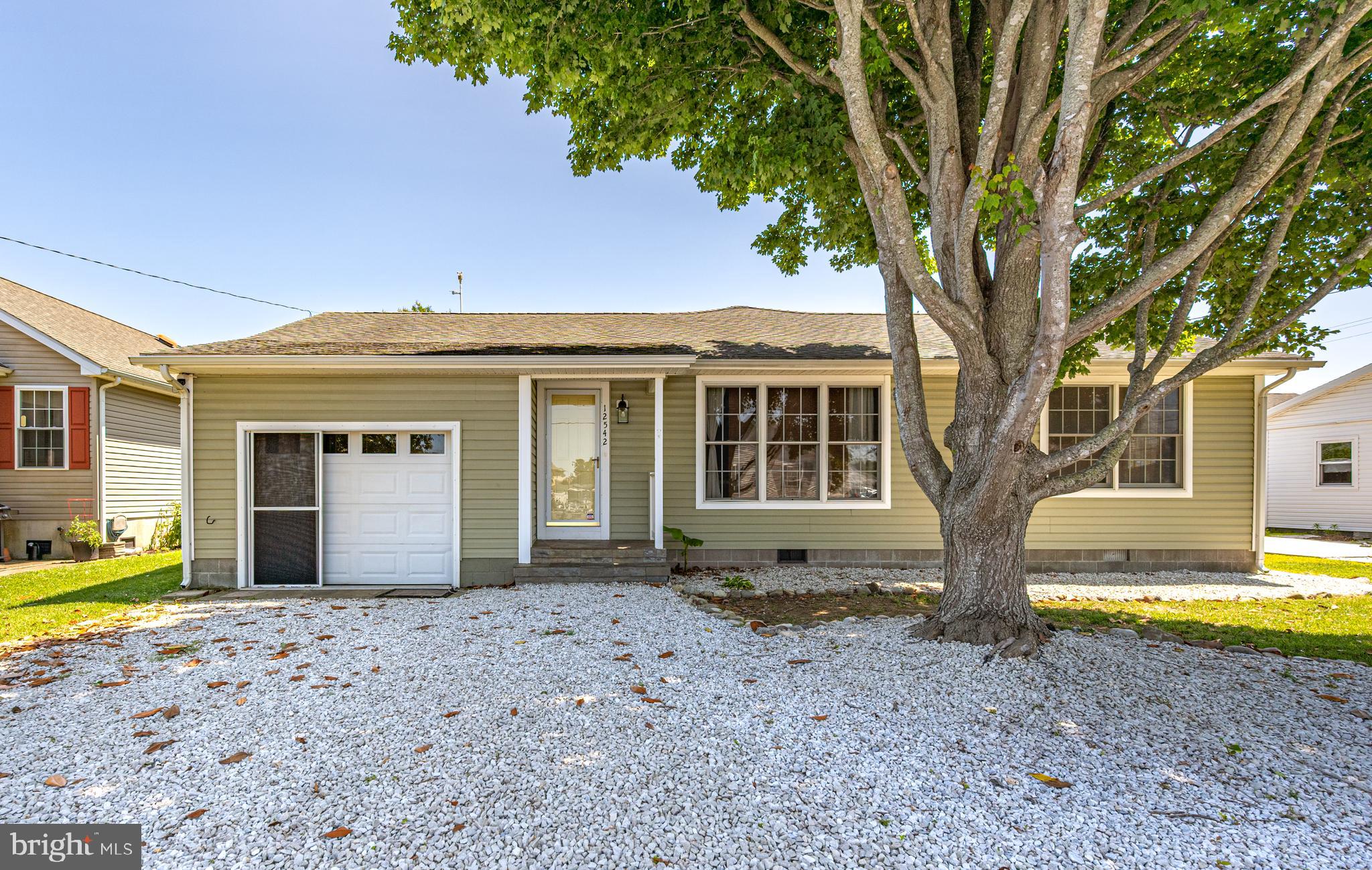 Charming Rancher in West Ocean City – No HOA, No City Taxes! This beautifully maintained 3-bedroom, 2-bath rancher offers comfort, style, and convenience—all just minutes from schools, shopping, and everything West OC has to offer. Step inside to find engineered hardwood and tile flooring throughout, with a spacious living room featuring a stylish barn door. The custom kitchen is a true standout with granite countertops, a breakfast bar and nook, stainless steel appliances, and a stunning herringbone tile backsplash. Enjoy outdoor living in the private, fenced-in backyard—perfect for entertaining—and rinse off after a beach day with the outdoor shower. The home also includes a 1-car garage with built-in cabinetry and a floored attic, offering ample storage space. Call for your personal tour!