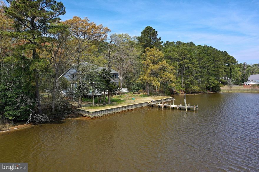 BACK ON THE MARKET! PEACEFUL COUNTRY LIVING WITH SCENIC COASTAL CHARM! HOME OFFERS THE BEST OF BOTH WORLDS! FEEL LIKE YOUR TUCKED AWAY IN THE COUNTRYSIDE, SURROUNDED BY NATURE, AS WELL AS A WATERMANS DREAM LOCATION! CUSTOM WATERFRONT MASTER PIECE ON HERRING CREEK! ONLY MINUTES TO THE COASTAL BEACHES, RESTAURANTS & SHOPPING!  Built in 2022 by Mark Iacona & Fivestar Builders. Welcome to this extraordinary custom-built home, perfectly situated on OVER 111 FEET OF WATERFRONT along the tranquil shores of Herring Creek. This 3-bedroom, 4-bath home with a flexible studio space (ideal as a 4th bedroom or home office) blends thoughtful design, craftsmanship, and sweeping WATER VIEWS IN EVERY ROOM into a one-of-a-kind COASTAL RETREAT. This all-electric home features a NEW PRIVATE WELL with an owned water conditioning system and custom shades throughout, offering comfort, efficiency, and elevated style. At the heart of the home, the chef’s kitchen is a culinary dream—featuring premium finishes, two walk-in pantries, and plenty of space to cook, host, and gather. The main level includes a welcoming foyer, spacious master suite with oversized tiled walk in shower, his-and-her sinks, private water closet, and gorgeous creek views. An open-concept living room with a wood-burning fireplace flows into a bright sunroom surrounded by windows that frame the serene landscape. Upstairs, two additional bedrooms, two full bathrooms, and a generous studio offer versatile space for guests or hobbies—all with abundant storage and more stunning water views. Step outside to a beautifully designed outdoor deck that’s perfect for entertaining or relaxing. Three electric awnings provide shade from the midday sun, creating a cool and comfortable space to enjoy your waterfront surroundings. The property boasts OVER 111 feet of newly bulkheaded water frontage, ideal for launching kayaks, canoes, personal watercraft (PWC), a skiff, or a pontoon boat. Whether you're boating, fishing, crabbing, or simply soaking in the views, this home delivers the ultimate waterfront lifestyle. Located on a quiet and scenic stretch of Herring Creek, this custom residence offers privacy, and seamless indoor-outdoor living. Access the property by a freshly paved private road & driveway! Schedule your showing today and discover this exceptional coastal gem!