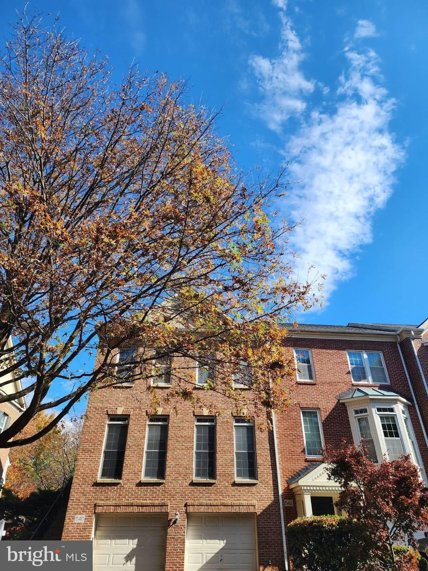 Spacious 2 car garage ,end unit ,brick front, 3-level town home located in sought after Rose Hill Falls subdivision, side entrance, Vaulted & Cath. ceilings, hardwood floor on main and lower levels, gourmet kitchen fully equipped with wall ovens, cooktop, refrigerator, dishwasher,  living  room  w/gas fireplace, spacious dining room,  Breakfast room w/French door to deck, butlers pantry w/wet bar; On upper level, there are a Master suite w/huge sitting area, master bath with garden tub and separate shower; walk-in closet, upper level laundry; 2 additional rooms with 1 full bath, walk-out lower level, recreation room & can-be-another bedroom/den, minutes to I-270 ,Metro and Rockville Town Center.