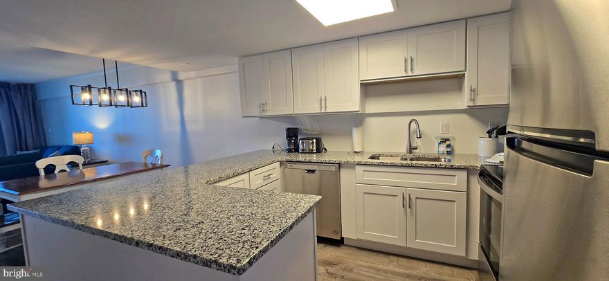 Stunning Renovated Direct Bayfront Condo with 2 Bedrooms, 2 Bathrooms & Community Boat Slips.  Experience Bayfront living at its finest in this beautifully renovated 2-bedroom, 2-bathroom condo featuring breathtaking panoramic views and resort-style amenities.  Upon entering, you’ll be welcomed by a spacious, modern kitchen showcasing granite countertops, solid wood shaker-style cabinetry, and newer stainless steel appliances—perfect for preparing your favorite meals or entertaining guests. The open floor plan flows seamlessly into the dining and living areas, all designed to highlight spectacular water views.  
Throughout the condo, a blend of tile and luxury plank flooring creates an inviting atmosphere that combines comfort and elegance.  The primary suite is a tranquil retreat, featuring corner windows that fill the room with natural light and offer stunning Bay views. The ensuite bathroom includes a tiled tub/shower combination, custom wood vanity, and comfort-height fixtures. Step through the sliding doors to your private balcony, where you can savor panoramic, cruise-like vistas and enjoy serene mornings with the Bay as your backdrop.  The second bedroom is equally spacious and well-appointed, offering luxury vinyl plank flooring, upgraded furnishings, and a private ensuite bathroom with a custom-tiled shower/tub combination and comfort-height vanity.   Additional features include a full-size washer and dryer, ample storage, and thoughtfully designed spaces that maximize comfort and convenience.  Residents enjoy a wealth of community amenities, including a year-round indoor heated pool, reserved parking, and community boat slips. With on-site professional management and maintenance, you can relax knowing everything is taken care of.  Condo fees include water, cable, and internet, adding ease and value to your lifestyle. Recent building upgrades include: New hurricane-grade windows and sliding balcony doors, 
updated exterior lighting and stairway doors, fresh building and roof coatings, enhanced lobby and improved common grounds, and new balcony railings with glass.   Enjoy the perfect combination of modern comfort, low-maintenance living, and unbeatable Bayfront views,  all within a beautifully maintained, amenity-rich community.  Professional pictures to follow.