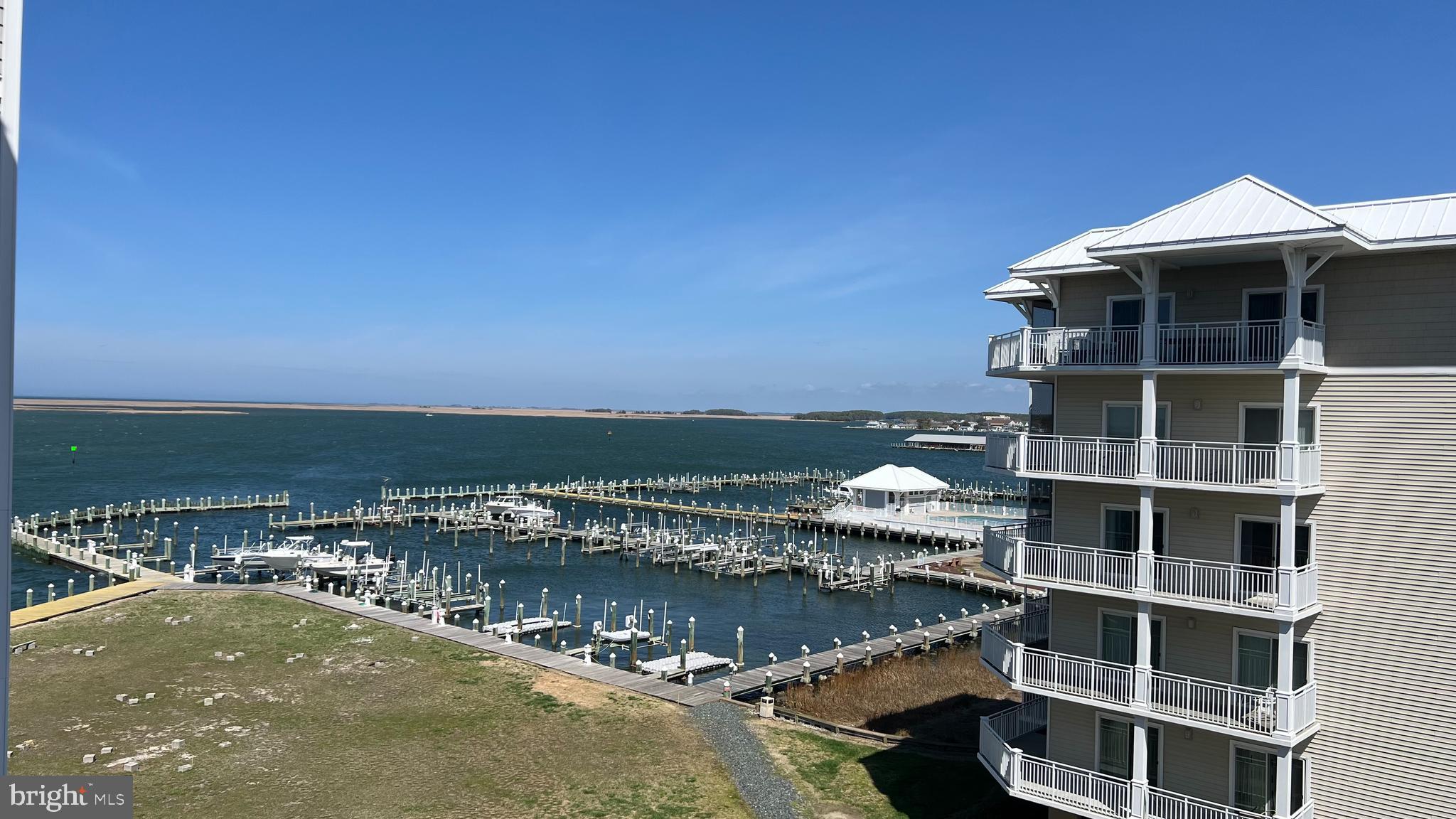 *******Private marina with your own deeded boat slip. The Harbour Lights condominium in Crisfield, MD, offers an opportunity to own a waterfront condo on the Chesapeake Bay.
This one-owner 3-bedroom 2-bath unit has never been used as a rental, ensuring it has been well-maintained and cared for.
Located in the heart of Crisfield known as the Seafood Capital of the world this condo provides breathtaking bay views of stunning sunrises, and sunsets, The spacious floor plan is designed to maximize natural light with large windows and private balconies perfect for watching boats pass by or relaxing with the bay breeze and the beauty of the Bay.
Residents of Harbour Lights enjoy amenities such as a waterfront pool, secured entrances to buildings, elevator access, and a private marina with your own deeded boat slip. Just a short distance to Jane's Island State Park and a boat ride to Smith and Tangier Islands, whether you are looking for a full-time residence or a vacation getaway just in time for summer, to own a piece of paradise on the Chesapeake Bay.