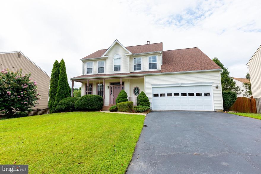 Welcome Home! One of the largest models in the subdivision! Beautifully updated 5 bedroom, 3.5 home in sought after area. Enter the home in grand fashion with high foyer ceilings, recently refinished hardwood floors and an upgraded kitchen with Newer Granite Countertops (2019), Newer Stainless Steel Appliances (2019) and ceramic tiles! Newer Blinds all around (2019-2020 )A Spacious A formal living room/dining room combo, and Family Room with fireplace compliments the main level along with a spacious Sunroom that fills the main level with access to the huge deck! Upstairs we have a Primary Bedroom with a spacious Sitting room, 2 walk-in closets, a spacious Primary Bathroom with dual vanity sinks, separate shower and a soaking tub! Ceiling fans in almost all bedrooms will keep you comfortable in this fairly recently painted home! Need an extra bedroom? Full legal bedroom and full bathroom in the basement for the extra guest and a walkout to the beautiful patio in the fully enclosed fenced backyard. Great privacy from the trees allows you to enjoy the time from the backyard or the spacious deck above. The two car garage allows direct entrance to the home. Carpet will be professionally cleaned before settlement, New Garage door (2020) and refinished Hardwood flooring (2020) on main level! 3 Floor Bump Out! Brand new Roof (2020)! Close to Quantico, major shops, restaurants, plazas, I 95 and major roads!