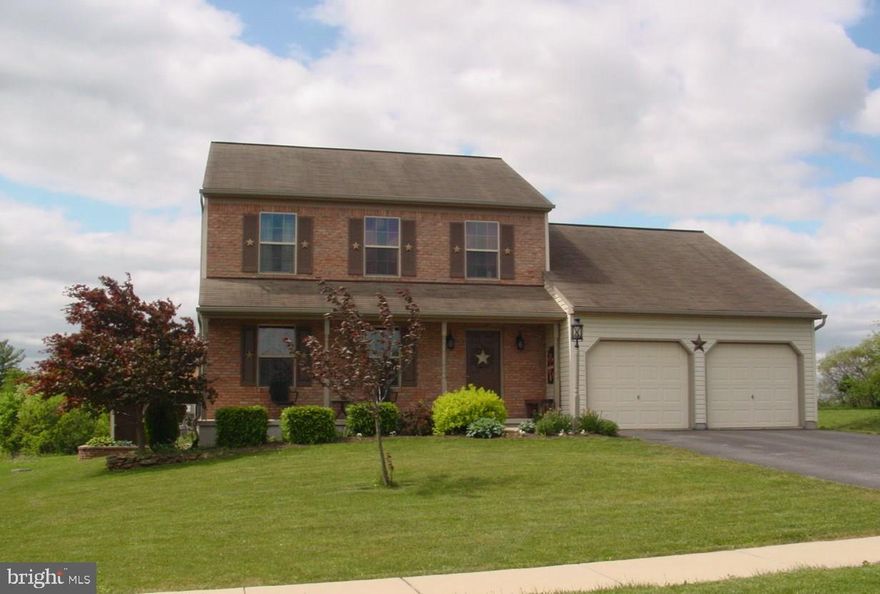 Lovely 2 Story Colonial w/brick front & full covered front porch. Large Country Kitchen w/Oak Cabinets & Brkfst Bar. Spacious 1st Flr Family Rm & Cozy Living Rm. Mud Rm off 2 Car garage. Master BR w/walk-in closet & private bath. Bsmt has 4th BR or Game Rm., workshop area, stg rm & laundry rm. Nice lot backs up to open space, paver patio & custom built stg shed.