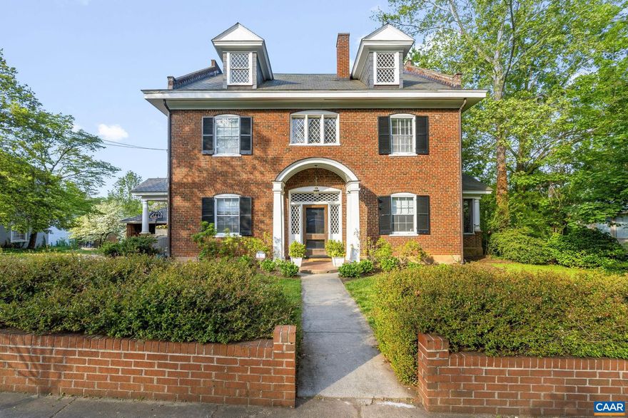 Don't miss this truly special property on an iconic circle just steps from the University! Spectacular Georgian Revival-style home feat. flemish bond brick exterior, slate roof, diamond shaped leaded glass windows + multiple porches.   Inside, CHARACTER at every turn in a grand 4-over-4 design w/ gracious spaces, dramatic 10' CEILINGS, heartpine floors + built-ins.  Recent RENOVATED KITCHEN + REIMAGINED PRIMARY SUITE inc. new stunning bathroom. 3 add'l bedrooms, sleeping porch + reading nook complete the 2nd flr.  Incredible potential to finish huge WALK-UP ATTIC with soaring ceilings (13 ft at ridge) or use now for storage.  Bright TERRACE LEVEL APARTMENT is ideal for add'l income or au pair/guest quarters.  Fantastic grassy backyard perfect for entertaining or play.  Ample off-street parking plus detached GARAGE. These homes rarely come available!,Cutting Board,Painted Cabinets,Fireplace in Living Room