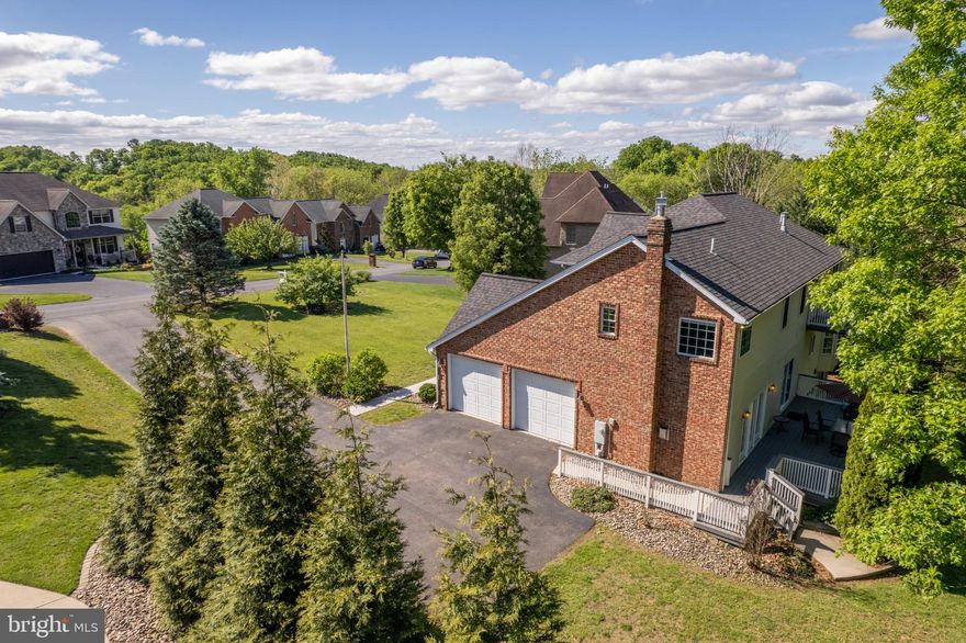 Video Tour is a MUST SEE! Ask for it Today!
Where Luxury Lives — And Nature Awaits Just Beyond Your Back Door
This brick colonial in the Greencastle Greens Golf Community delivers over 4,650 finished square feet of thoughtfully upgraded living space — and then offers something truly rare: your own private pathway to nature, steps from the Conococheague Creek.
From the moment you enter, the scale and quality make an impression. The gourmet kitchen is where this home truly earns its reputation. Stretching 26x13 feet with over 40 feet of counter space, this is a kitchen that handles everything from quiet weekday breakfasts to full holiday gatherings without breaking a sweat. The 10-foot island anchors the space beautifully, wrapped in Kashmir White granite and surrounded by LifeArt solid wood cabinetry with furniture-grade finishes, dovetail drawer construction, 42-inch wall cabinets, and 65 soft-close doors and drawers — including three glass-front display cabinets that add a touch of elegance. A gas cooking range, stainless appliances, convenient pantry, recessed lighting, casement windows, and a reverse osmosis drinking water system complete a kitchen that is as functional as it is stunning. A sliding door opens directly to the rear deck, making outdoor dining effortless.
The sunken family room — with its gas fireplace and French doors — flows seamlessly to a 30x14 rear deck overlooking a wooded backdrop built for every season.
Upstairs, the primary suite is a world of its own: trayed ceilings, a private sitting room with a gas fireplace, an intimate morning coffee balcony, and a spa-inspired bath complete with dual vanities, a jetted soaking tub, and a glass walk-in shower.
The lower level raises the bar entirely — a 48-foot rec room anchored by a 17-foot horseshoe granite wet bar with Brooklyn loft-style brick wall accents, a full bath, and a dedicated theater room with projector and screen. 
For peace of mind in 2020 the roof had a major upgrade to 50 Year Long-Life, IKO Dynasty/Cambridge Architectural Shingles and to give additional comfort and security, the heat pumps have been recently replaced; one in 2021 and the other in 2023.
Then step outside — and let the land tell its own story. A short walk through your wooded backyard opens up to over an acre of flat, open ground a few steps from the banks of the Conococheague Creek — and what awaits you there is nothing short of remarkable. This is the kind of land that invites you to slow down and build something meaningful. Pitch a tent and wake up to wild flowers and bird songs. Raise a pavilion for family gatherings under the trees. Carve out a meditation space where the sounds are mostly water, wind, and wildlife. Watch deer slip quietly through the tree line. Listen to ducks and geese settle onto the creek at dusk. Spot wild turkey moving through the brush, and squirrels working the canopy overhead. As evening falls, the soundtrack shifts — spring peepers, crickets, tree frogs, and the distant call of an owl fill the air in a way no playlist ever could. Why drive fifty miles for a weekend escape when yours is already waiting, just steps from your back door?
Located in the sought-after Greencastle-Antrim School District, minutes to I-81, with recent upgrades throughout.
Schedule your private tour today and experience everything this extraordinary home — and its land — has waiting for you.