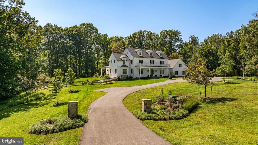 Tucked behind the gates of one of Baltimore County’s most prestigious communities, this newly constructed 2023 estate embodies timeless sophistication and modern comfort. Accessed by a long private drive and surrounded by nearly 18 wooded acres, the residence offers complete privacy with sweeping 180-degree views of nature — a true sanctuary in the heart of the Falls Road Corridor. Spanning more than 7,650 square feet, the home showcases impeccable craftsmanship, exquisite millwork, and a seamless blend of classic and transitional design. The gourmet kitchen is a showpiece, featuring Sub-Zero and Wolf appliances and an open layout that flows effortlessly into elegant living and dining spaces. The spa-inspired primary suite is a retreat of its own, complete with heated marble floors, soaking tub, and a walk-in shower. With five ensuite bedrooms, six and a half baths, and thoughtfully designed gathering spaces throughout, this home balances grand scale with inviting warmth. Expansive grounds offer ample room for a pool or future outdoor oasis. A rare opportunity to experience unmatched privacy, luxury, and convenience — just minutes from all that Baltimore County has to offer.