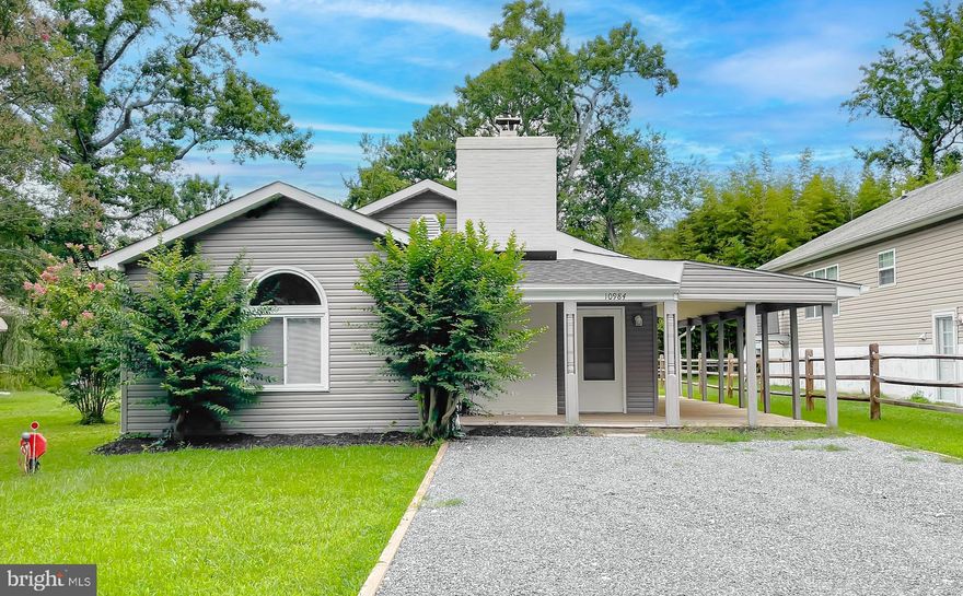 Located in the private beachfront community of Cove Point, this 3-bedroom, 2-bath home offers 1,767 square feet of extensively updated living space just steps from the Chesapeake Bay.

The interior has been renovated with a clean, cohesive finish throughout. The kitchen features shaker-style cabinetry, quartz countertops, stainless steel appliances, recessed lighting, and wide-plank flooring that continues through the main living areas. A tiled fireplace feature wall anchors the living space, while both bathrooms have been updated with contemporary finishes and large-format tile surrounds.

Recent mechanical upgrades include a tankless hot water heater, whole-home water filtration system, and a new holding tank system.

Cove Point residents enjoy private beach access along the Chesapeake Bay, offering true coastal living while remaining convenient to local shopping, dining, and commuter routes.
