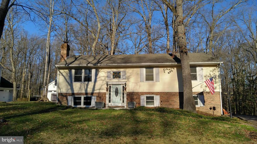 Wonderful, large home with tons of living space! Upper level has open floorplan with large living room that flows into a dining room and kitchen, both with vaulted ceilings and exposed beams over the kitchen. Large family room on the lower level with fireplace. Tons of natural light! Master bedroom has access to huge deck off the rear of the home. Enjoy spring and summer BBQing outdoors!