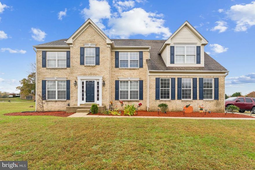 Tucked away on nearly two private acres with no HOA, this brick-front colonial feels like home the moment you walk in. Every detail has been cared for. From the fresh landscaping and open yard to the newly painted interior that flows effortlessly from room to room.
Inside, sunlight pours through the 2-story foyer leading to an open great room anchored by a cozy gas fireplace. The kitchen is the heart of the home, featuring a center island with a gas cooktop and vented hood, double wall ovens, a brand-new stainless refrigerator (2025), two pantries, ceramic tile backsplash, and rich hardwood floors that extend throughout the main level. The formal dining room and main-level flex space (perfect as an office or playroom) add both function and charm.
Upstairs, the primary suite is its own retreat complete with an office-style sitting area, dual walk-in closets with custom shelving, and a spa bath with double vanities, soaking tub, and separate shower. Every bedroom upstairs includes a ceiling fan and plenty of natural light.
The finished lower level provides even more possibilities, offering a spacious recreation room, full bath, and two additional bonus rooms perfect for a home gym, guest space, or hobby area.
Step outside and enjoy evenings surrounded by nature. Play a round on the basketball court, relax by the pool, or take in the view of the pink cherry blossom tree in the front yard. The property also includes a spacious shed behind the home and a 6-car parking area, offering plenty of room for guests, hobbies, and storage.
Thoughtful upgrades include a new hot water heater (2025), built-in cabinetry in the laundry room, new well tank, sump pump, septic risers, LED lighting, and HVAC (2022).Located just 20 minutes from I-495 with easy access to Patuxent River NAS, Andrews AFB, Bolling, and Indian Head and zoned for sought-after White Marsh schools. This home truly offers the space, comfort, and peace you’ve been searching for!