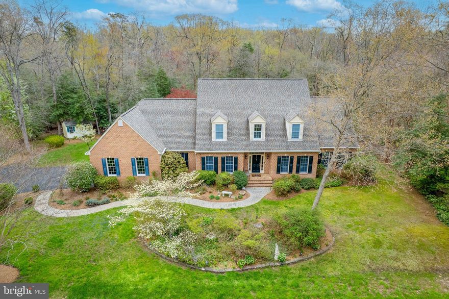 Fantastic brick front Cape Cod, quality built by KOCH Homes! First time offered for sale! This lovely 1/2+ acre property backs to Quiet Water’s Park with Harness Creek water access.  Enjoy three finished levels! Step into a welcoming two-story foyer and a soaring two-story family room with a propane gas fireplace that opens to the spacious kitchen with eating area and large center island! A very large laundry room/mud room with additional storage is conveniently located off both the garage and kitchen.  
The large first floor owner suite features a walk-in closet, spacious owner bath, and a separate  office/sitting room with additional closet space and an atrium door leading to the deck! Separate living room and dining room with hardwood floors! Hardwood floors extend throughout the first level!  
Upstairs offers three generous sized bedrooms and a large full bath! The lower level provides an enormous finished recreational room and plenty of unfinished space for all your storage needs.  
With a little cosmetic updating this home will be your dream!