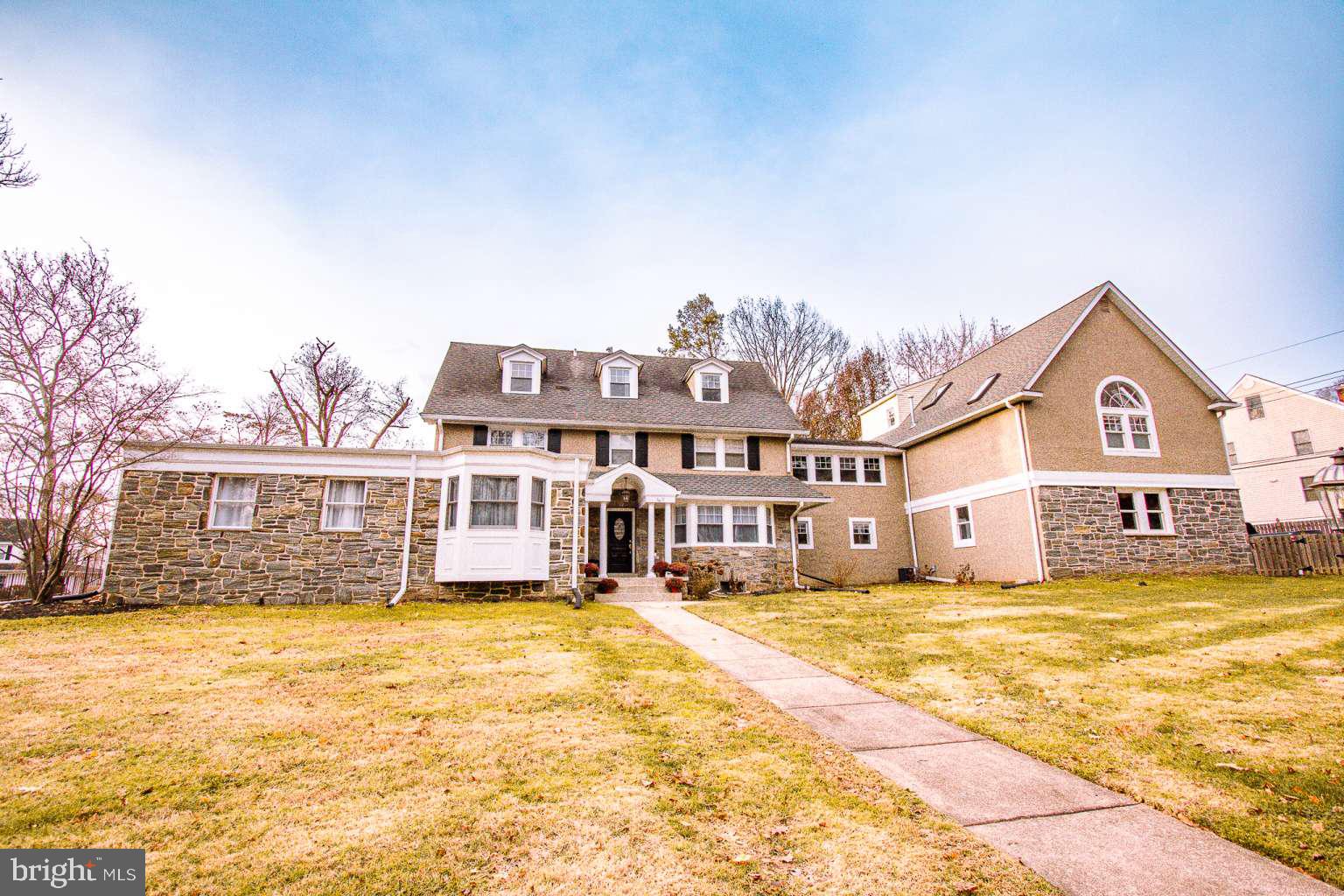Motivated seller! Welcome to 140 North Rolling Road, Springfield, PA 19064 – a breathtaking luxury estate nestled in one of the most sought-after neighborhoods. This 6900 square foot exceptional property is one of the largest in Springfield and epitomizes elegance, comfort, and modern sophistication. The owner runs a construction building firm and can make any customizations to the home you desire. The property is zoned as residential and commercial, making it the perfect spot for your business, in-laws quarters or a separate apartment. Key Features: Stunning Curb Appeal: As you approach, you'll be captivated by the beautifully landscaped front yard and classic colonial architecture, exuding elegance and welcoming you home. Spacious Interior: This expansive home boasts 6 bedrooms and 4 full bathrooms, providing ample space for family living and entertaining. The living areas are flooded with natural light, creating a warm and inviting atmosphere. Spacious Living Areas: The expansive open floor plan seamlessly connects the living, dining, and family rooms, creating an ideal space for both entertaining and everyday living. Large windows flood the home with natural light, highlighting the exquisite hardwood floors and custom moldings. Gourmet Kitchen: The heart of the home is the state-of-the-art gourmet kitchen, equipped with top-of-the-line stainless steel appliances, custom cabinetry, Quartz countertops, and a generous center island with a farmhouse sink. Whether you’re a culinary enthusiast or love hosting dinner parties, this kitchen will exceed your expectations. Luxurious Master Suite: Retreat to the master suite, a true sanctuary featuring a spacious bedroom, walk-in closets, and an en-suite bathroom that can be customized for you by the builder/owner. Wake up and unwind in ultimate comfort. Additional Bedrooms and Bathrooms: The home boasts five additional bedrooms, each with its own unique charm and ample closet space. The well-appointed bathrooms include four full baths, each designed with luxury and convenience in mind. Home Office and Library: For those who work from home, there are multiple spaces for dedicated home offices that offer a quiet and productive space. A cozy library and game room area provides the perfect spot for reading and relaxation. There is a separate room that could be converted to a playroom. Commercial & Residential Zoning: The property is zoned commercial and residential so you can use your business or convert the space to an in-laws quarters or separate apartment. Prime Location: Situated in the heart of Springfield, this home offers easy access to top-rated schools, shopping, dining, and recreational facilities. Enjoy the perfect blend of suburban tranquility and urban convenience. Modern Amenities: This home is equipped with the latest smart home technology, including a security system, climate control, and energy-efficient appliances, ensuring peace of mind and sustainability. Convenient Commute: Just a short drive to major highways and public transportation, making commuting to Philadelphia and surrounding areas a breeze. Don’t miss the opportunity to own this spectacular property at 140 North Rolling Road. Schedule your private tour today and experience luxury living at its finest. This home is more than just a place to live – it’s a lifestyle. Make this dream home yours!