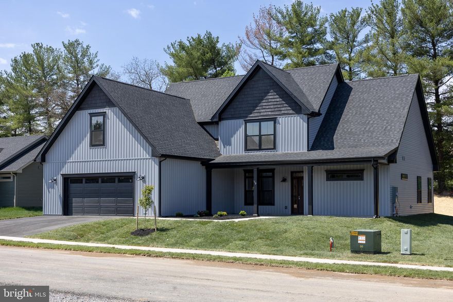 INTRODUCING “The Boulder” – a brand new floorplan built by Panhandle Homes of Berkeley County!  Construction is complete - MOVE IN READY!! The pictures are of the actual home, schedule a tour today.  Take advantage of the upgrades the builder included in this home and be one of the very first residents in “Meadow Crest” - a brand new subdivision in the Spring Mills area.  This floor plan has everything you need on the main level, with plenty of guest/flex space upstairs.  
The Owners Suite is on the MAIN LEVEL and has a luxury bathroom with two separate vanities, ceramic tile shower, private water closet and a HUGE walk-in closet.  The gourmet kitchen has a large, sit at island – perfect for everyday living and entertaining, a walk-in pantry and tons of cabinetry.  There is a dining/flex area off of the great room with wooden posts that match your stained front entry door.  The foyer has a media closet for your router with all your ethernet connections throughout the home hardwired back to.  The entry hall when you enter the home from the garage has a powder room, laundry room with a linen closet and wide stairs going to the 2nd level.  
Upstairs you’ll find a spacious landing area, 2 large secondary bedrooms - BOTH bedrooms with walk in closets, a full bathroom with a double bowl vanity, a linen closet plus a 16’x18’ unfinished bonus room – prepped to be finished in the future, or great left as-is for storage.
The oversized 600 sq ft garage comes with a smart opener, external keypad and large mechanical closet.  Outside you will find covered front (279 sq ft) & rear (220 sq ft) porches with PLENTY of space for outdoor furniture.  This home backs a tree line and has no neighbors directly behind you.