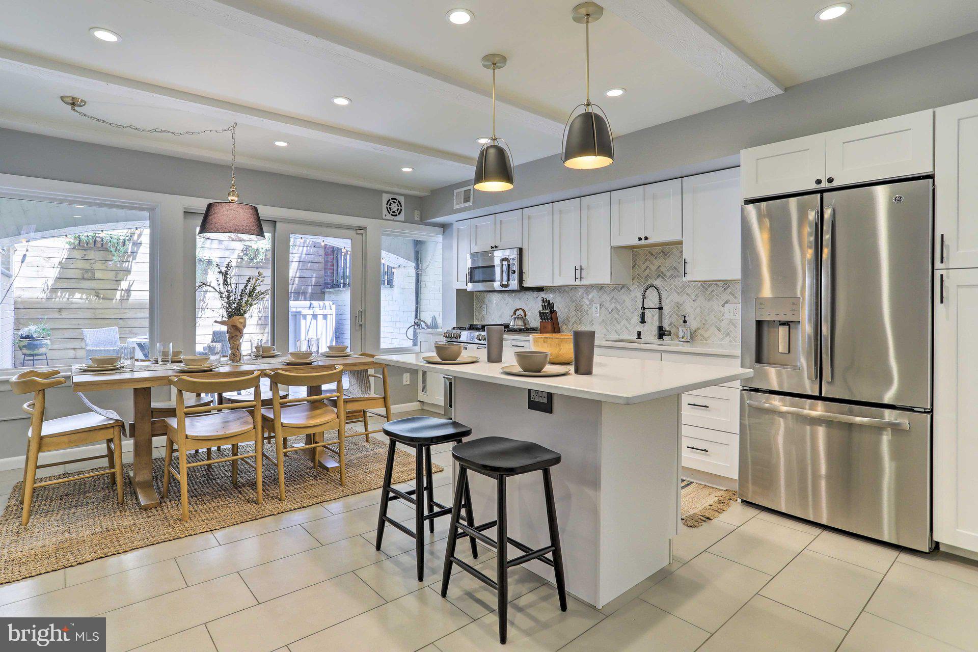 Imagine living in the HEART OF CENTER CITY and just minutes from Washington Square , where everything you need is just steps away—restaurants, Whole Foods, bars, shops, Jefferson and Pennsylvania Hospitals, Seger Park, fabulous theaters—all without ever needing to drive. That’s exactly what city living should be, and it’s exactly what you'll find at 1201 Lombard Street. Welcome to this one-of-a-kind, beautiful CORNER-HOUSE that truly has it all.
From the moment you step inside, you'll be greeted by an abundance of natural sunlight streaming through the LARGE WINDOWS, creating a warm and inviting atmosphere. Just a few steps up, you'll find a spacious living room featuring a modern accent wall and peaceful garden views that offer a surprising sense of tranquility amidst the buzz of the city. For those who work from home, there’s a cozy home office or den tucked just around the corner—complete with a FIREPLACE—making your workspace anything but boring.
Heading downstairs, you’ll discover a bright, updated eat-in kitchen perfect for entertaining friends and family for years to come. Through the sliding glass doors, step out into your own PRIVATE PATIO oasis, complete with a wood accent wall and lush plant decor—ideal for city BBQs or simply relaxing outdoors. This level also includes a convenient half bathroom and a utility room with a washer and dryer.
Upstairs on the third level, you’ll find a generously sized bedroom and the luxurious primary suite featuring an elegant marble en suite bathroom—perfect for soaking in the tub after a long day. The primary bedroom also includes access to a small BALCONY that fills the space with natural light.
Ascend to the fourth level, and you'll find a sun-drenched room that can serve as a third bedroom or be transformed to suit your needs. This floor also boasts a full bathroom and access to a stunning ROOF DECK through elegant French doors. With sweeping city views, it’s the perfect spot to sip wine, entertain, or unwind.
Don’t miss the opportunity to own this exceptional home in an unbeatable location. Come see 1201 Lombard Street for yourself and make an offer before it's gone. This is city living at its finest and best definition of value and luxury!