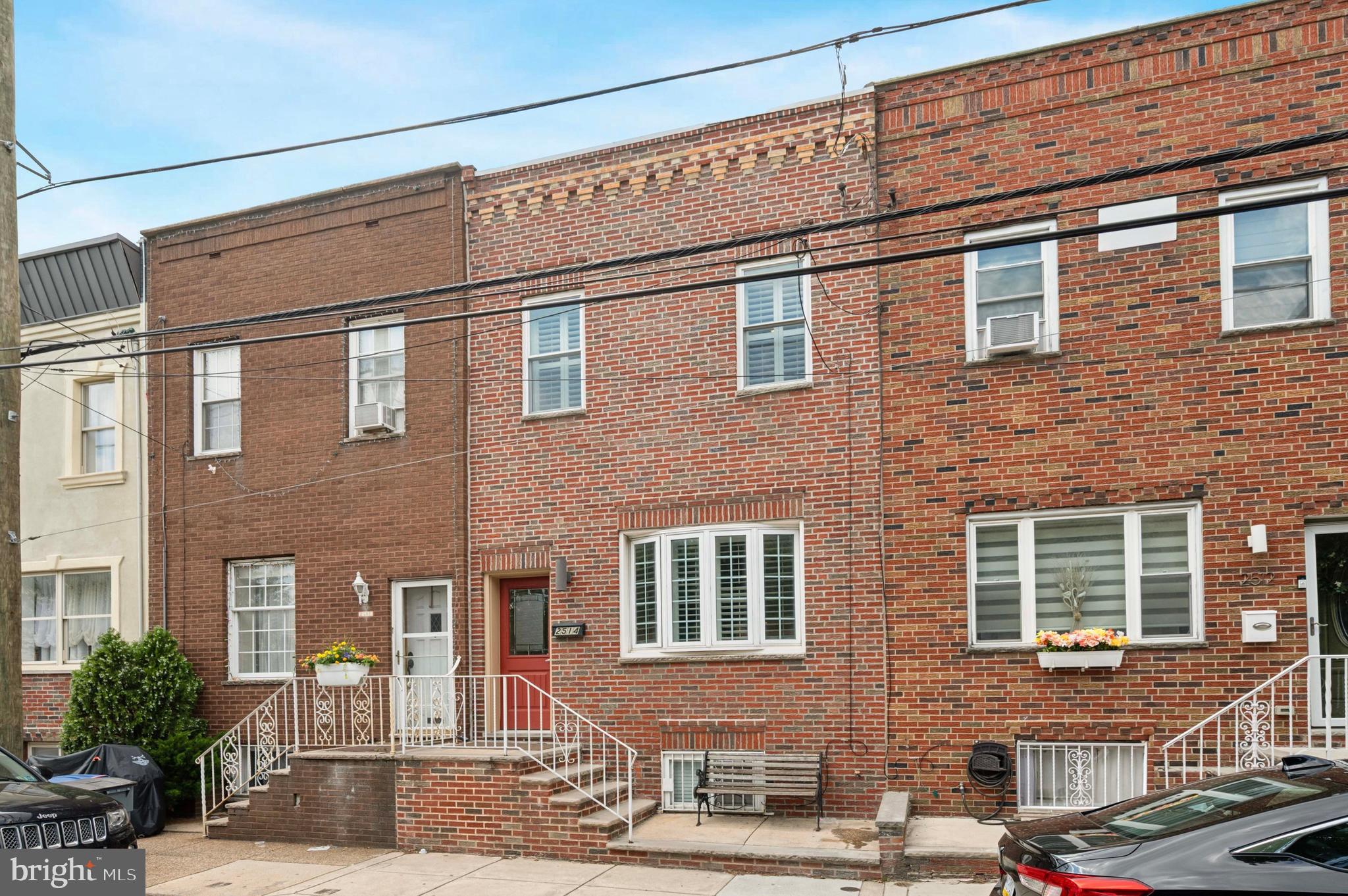 Welcome Home! Step into this beautifully maintained and well-appointed 16 FT - WIDE, 3 bedroom, 1 bathroom brick row home, nestled in the vibrant heart of South Philadelphia. From the moment you walk in, you’ll be greeted by a warm and inviting ambiance, highlighted by gleaming hardwood floors that flow throughout the home. The spacious living room features a large bay window that fills the space with natural light. A connected dining area offers a coat closet and creates a seamless transition to the heart of the home. An upgraded kitchen with modern cabinetry, gas cooking, stainless steel appliances, sleek countertops, and a stylish backsplash. Whether you're cooking for one or entertaining guests, this space is as functional as it is beautiful. Step right outside to a partially covered patio, perfect for enjoying summer evenings or crisp fall nights. Upstairs, you’ll find a stunning primary bedroom with soaring tray ceiling and a generous closet. Two additional bedrooms offer great space and natural light. The hall bathroom features neutral tile, large vanity and tub shower with floor to ceiling tile. The finished basement provides additional flex space ideal for additional entertaining space, home office, gym, or rec room plus a large laundry and utility area with plenty of storage. All of this located just steps from the stadiums, public transportation, parks, restaurants, and everything South Philly has to offer. Walking distance to Passyunk ave restaurants. Quick access to all types of transportation. Minutes to Center City and the PHL international airport. Home is where your story begins! Agent is related to seller.